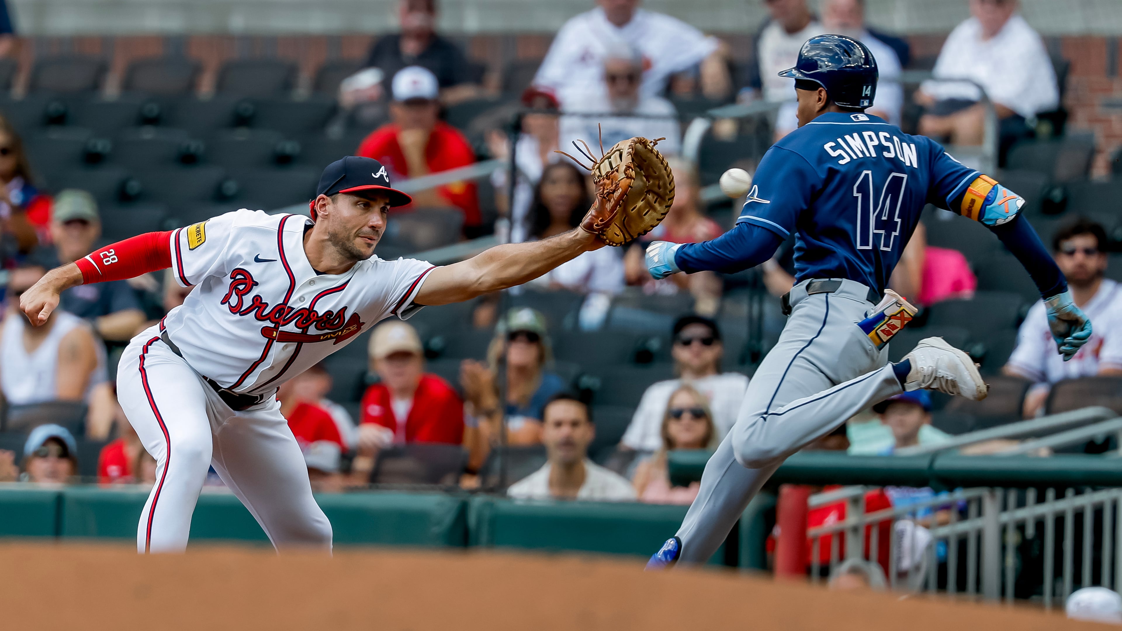 Braves first baseman Matt Olson (left) catches the throw to get the Rays' Chandler Simpson out and complete a double play during the first inning Thursday, Sept. 10, 2026, in Atlanta. The double play got Braves pitcher Martín Pérez out of a bases-loaded jam. (Erik S. Lesser/AP)