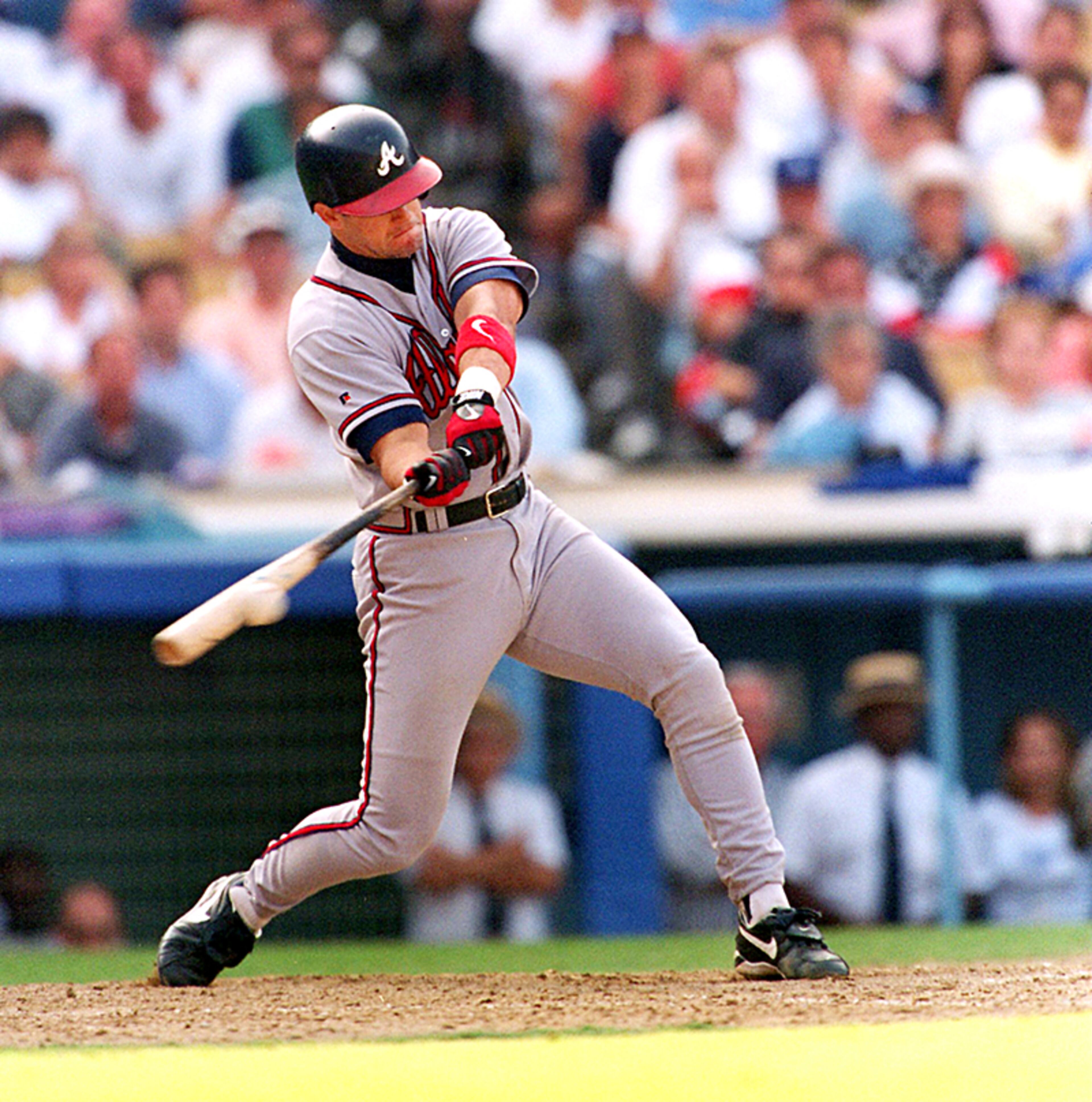 Atlanta Braves catcher Javier Lopez raps the game-winning solo homer in the top of the 10th inning to give the Braves a 2-1 win over the Los Angeles Dodgers in the opening game of the National League Division Series.