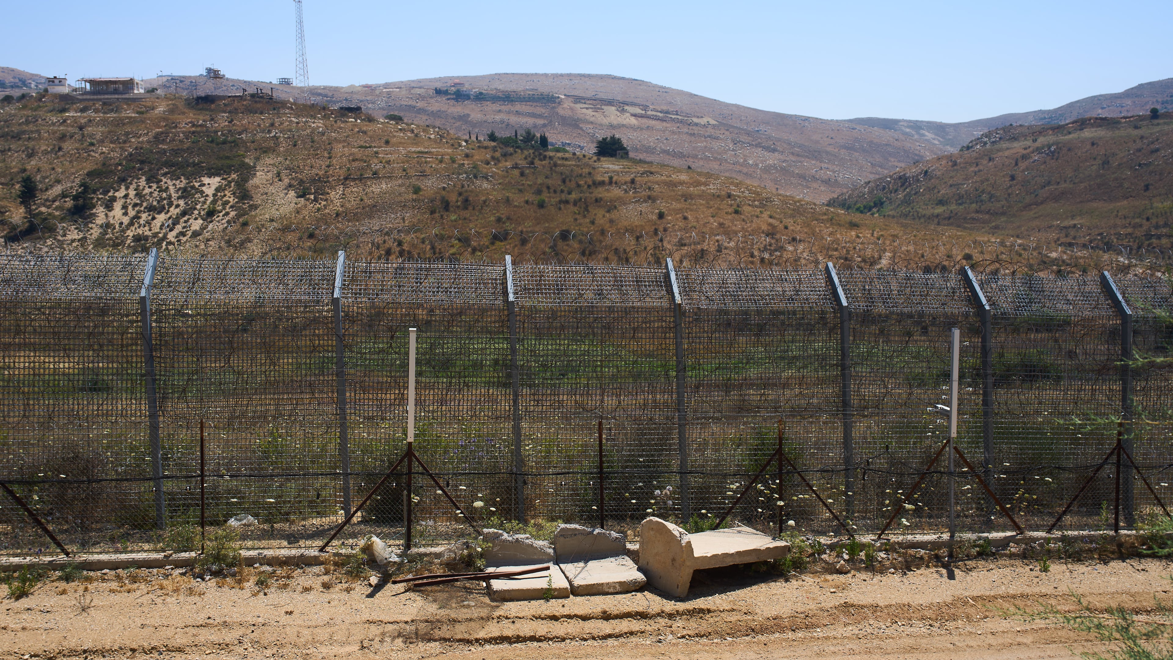 The border between Syria and the Israeli-controlled Golan Heights town of Majdal Shams is seen Tuesday, July 21, 2026. (AP Photo/Ariel Schalit)