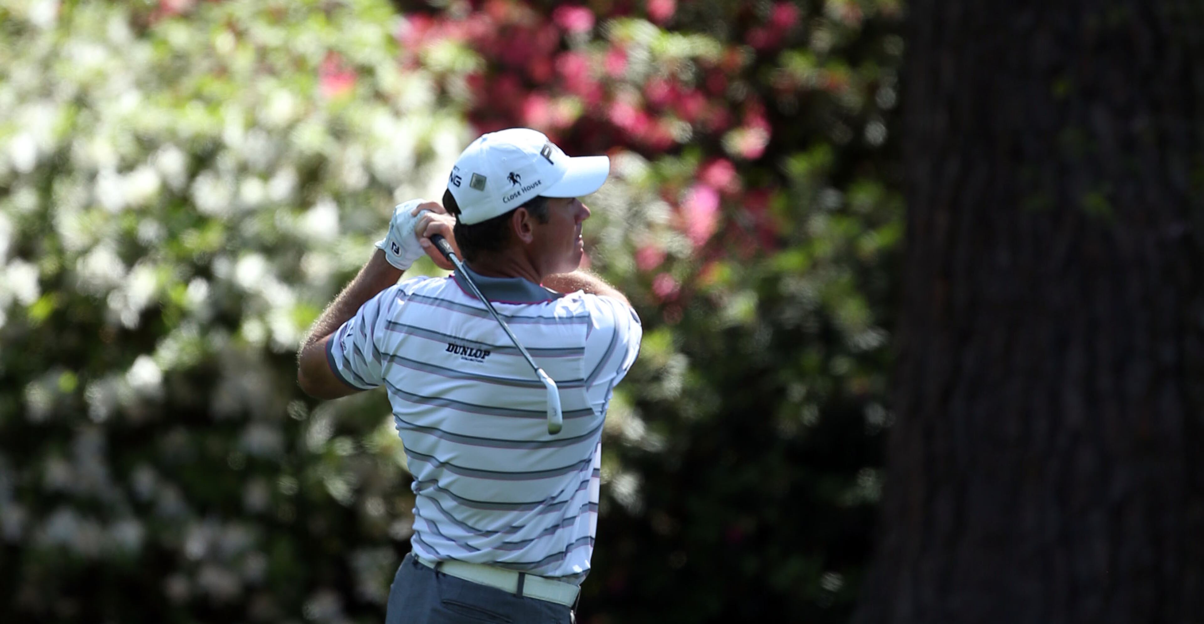 Lee Westwood hits in front of the azaleas on #13 during the second round in the Masters Tournament on Friday April 12 2013. JASON GETZ / JGETZ@AJC.COM
