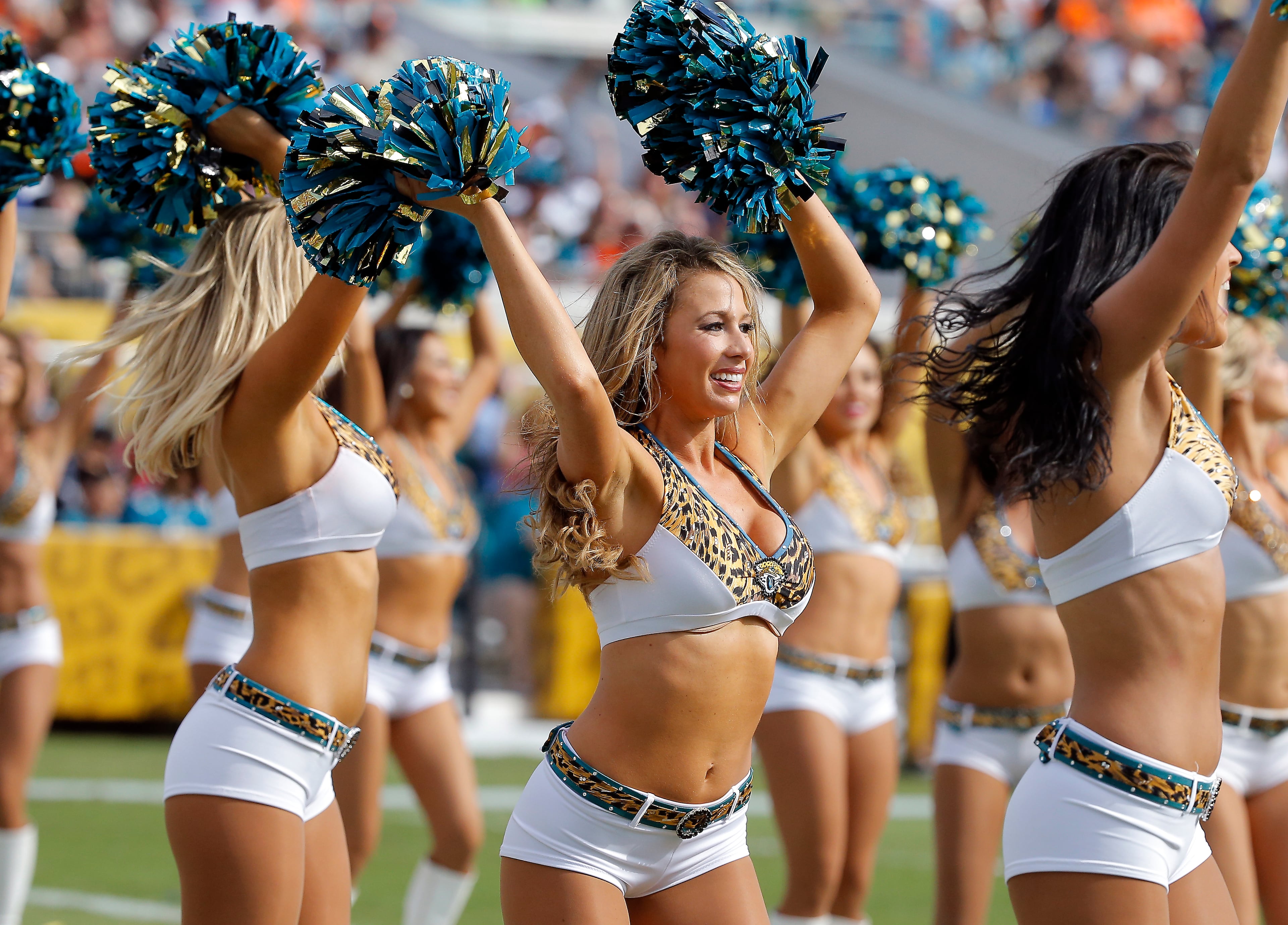 Members of the Jacksonville Jaguars Roar Cheerleaders perform during the second half of an NFL football game against the Cleveland Browns, Sunday, Oct. 19, 2014, in Jacksonville, Fla. The Jaguars beat the Browns 24-6. (AP Photo/Stephen B. Morton)