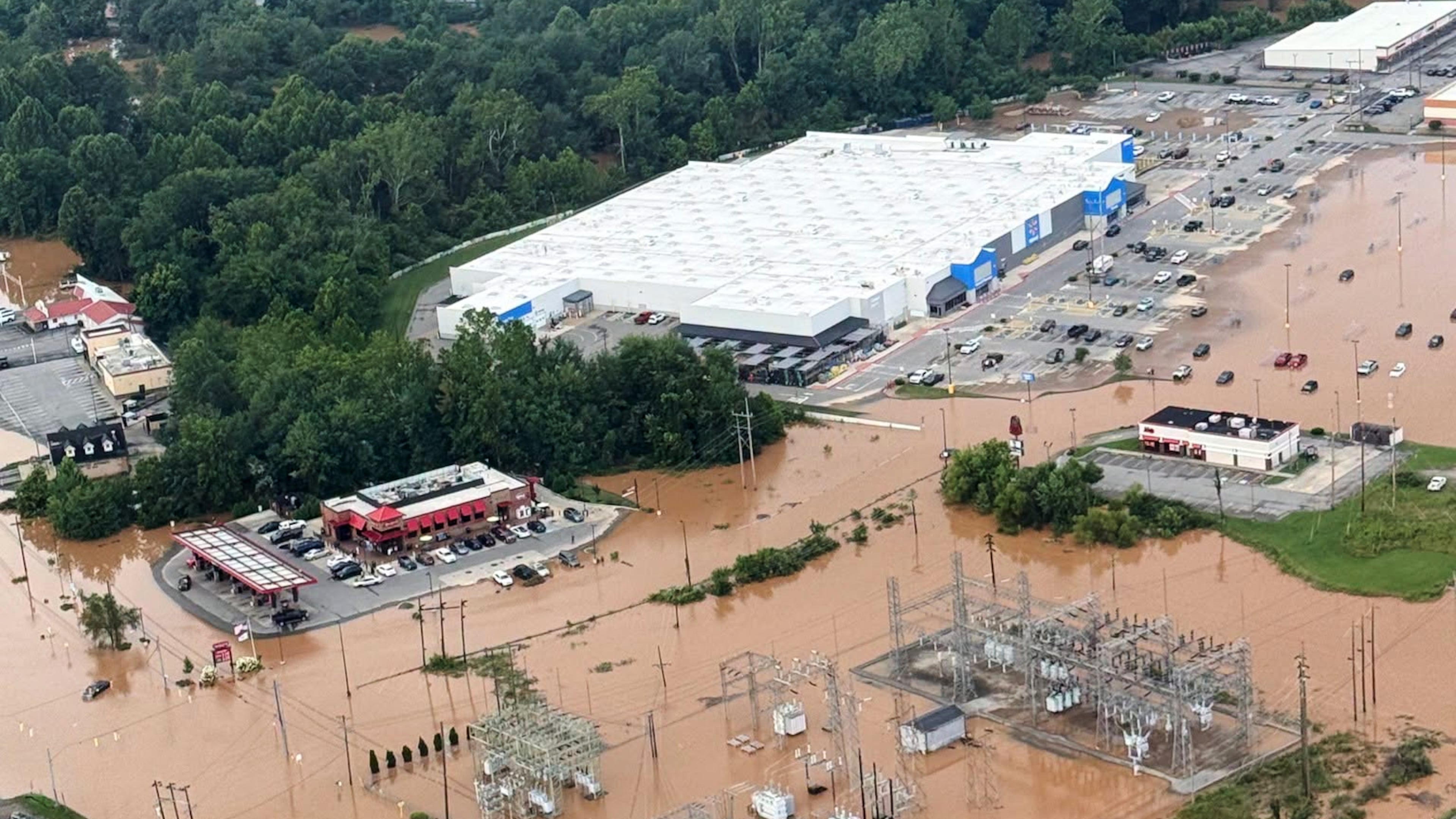 An Aerial view shows extensive flooding in Buckhannon, W.Va., Wednesday, July 22, 2026. (Office of West Virginia Gov. Patrick Morrisey via AP)