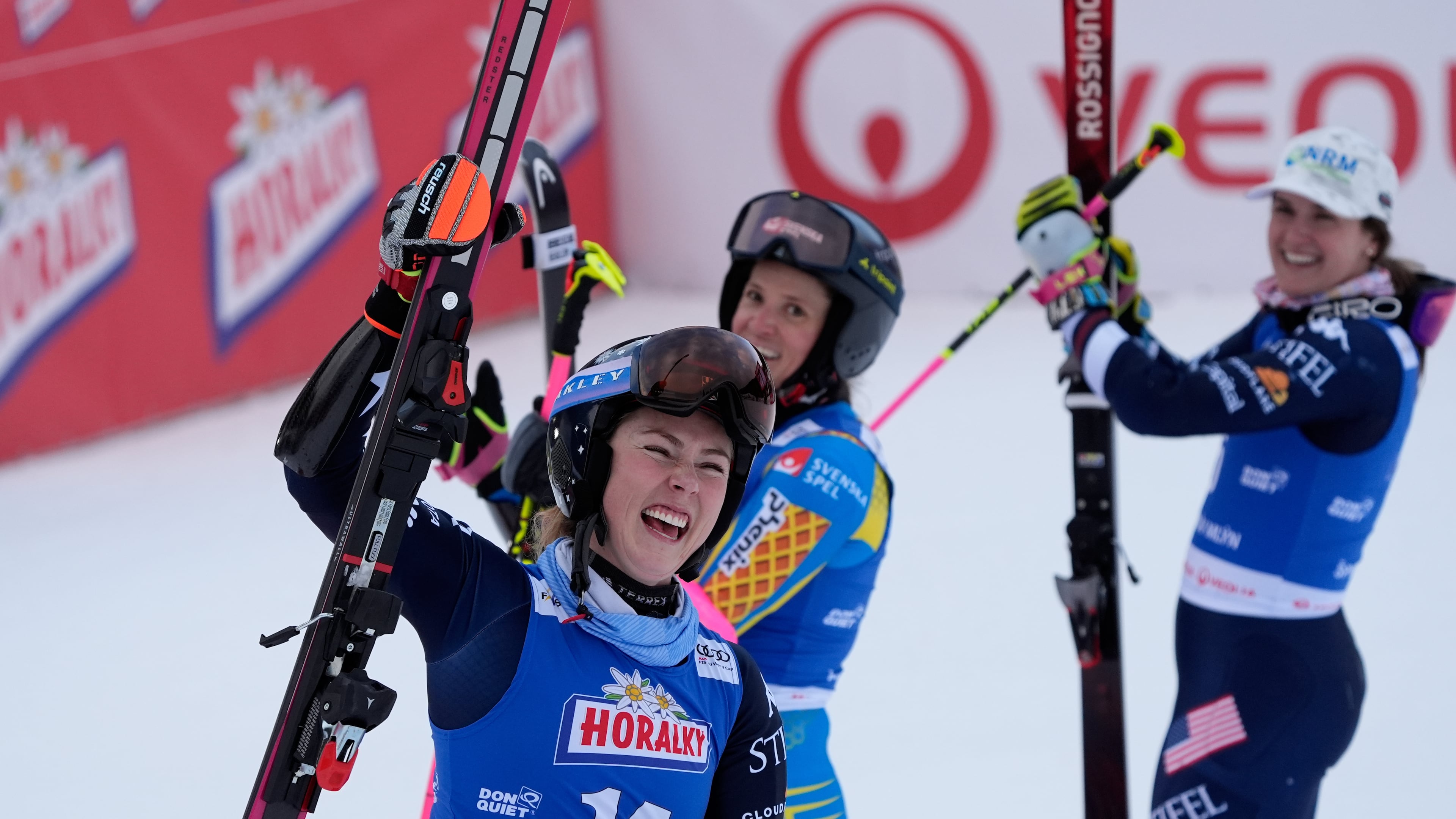 From left, United States' Mikaela Shiffrin, Sweden's Sara Hector and United States' Paula Moltzan at finish line during a women¥s alpine ski, World Cup giant slalom, in Spindleruv Mlyn, Czech Republic, Saturday, Jan. 24, 2026. (AP Photo/Giovanni Auletta)