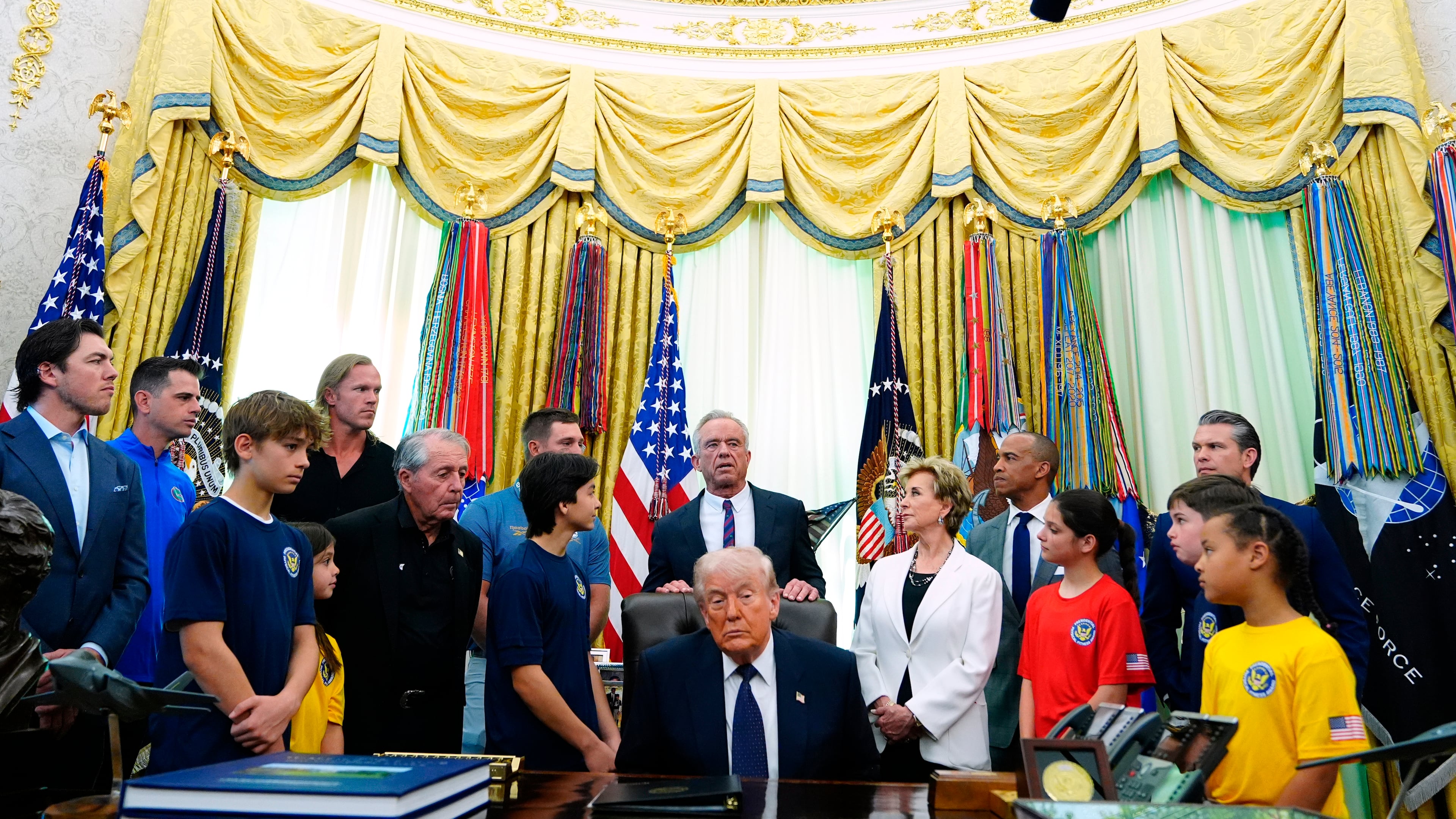Health and Human Services Secretary Robert F. Kennedy Jr. speaks as President Donald Trump listens before the signing of a proclamation in the Oval Office at the White House, Tuesday, May 5, 2026, in Washington. (AP Photo/Jacquelyn Martin)