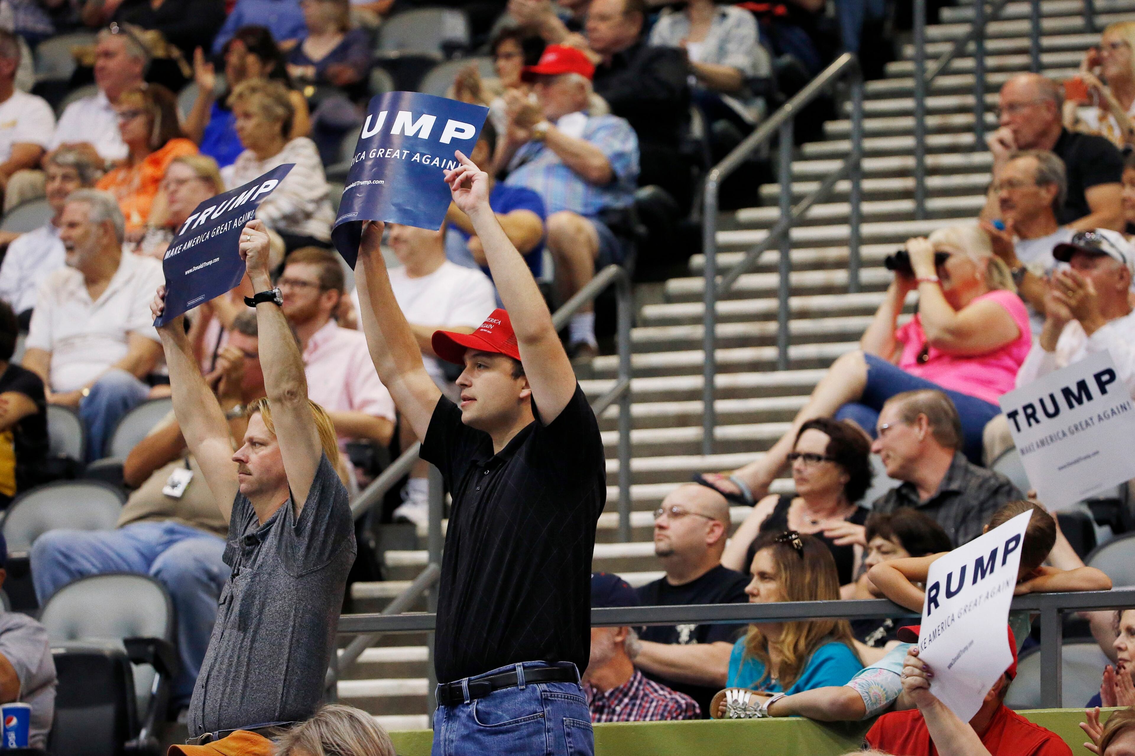 Supporters of Republican presidential candidate Donald Trump listen to him speak during a campaign rally Saturday, March 19, 2016, in Tucson, Ariz. (AP Photo/Ross D. Franklin)
