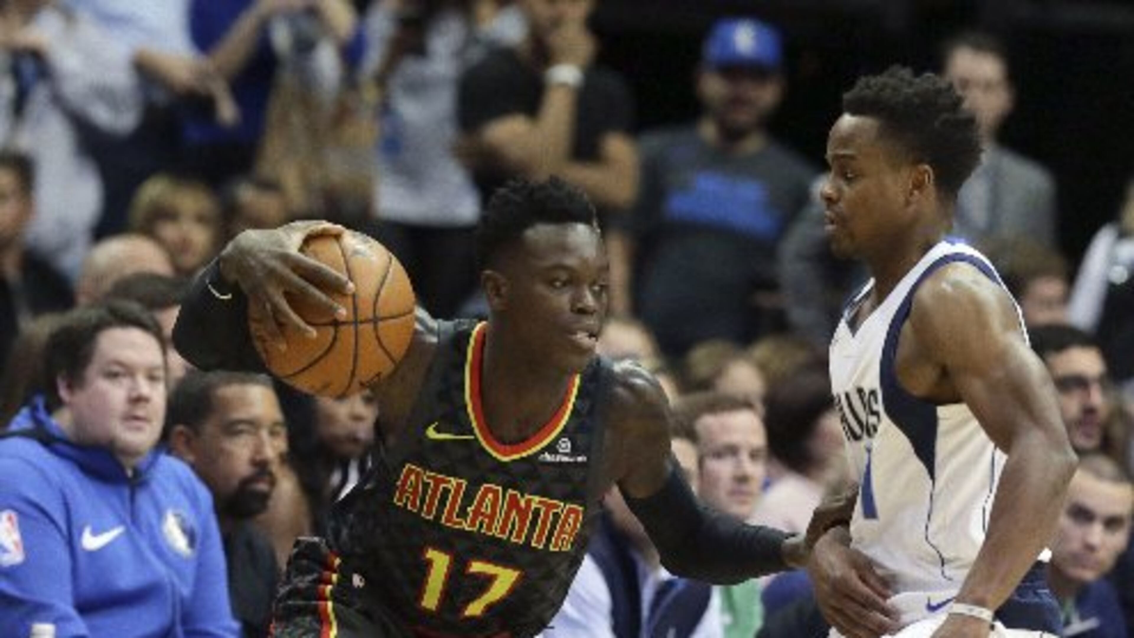 Hawks guard Dennis Schroder drives by Yogi Ferrel. (AP Photo)