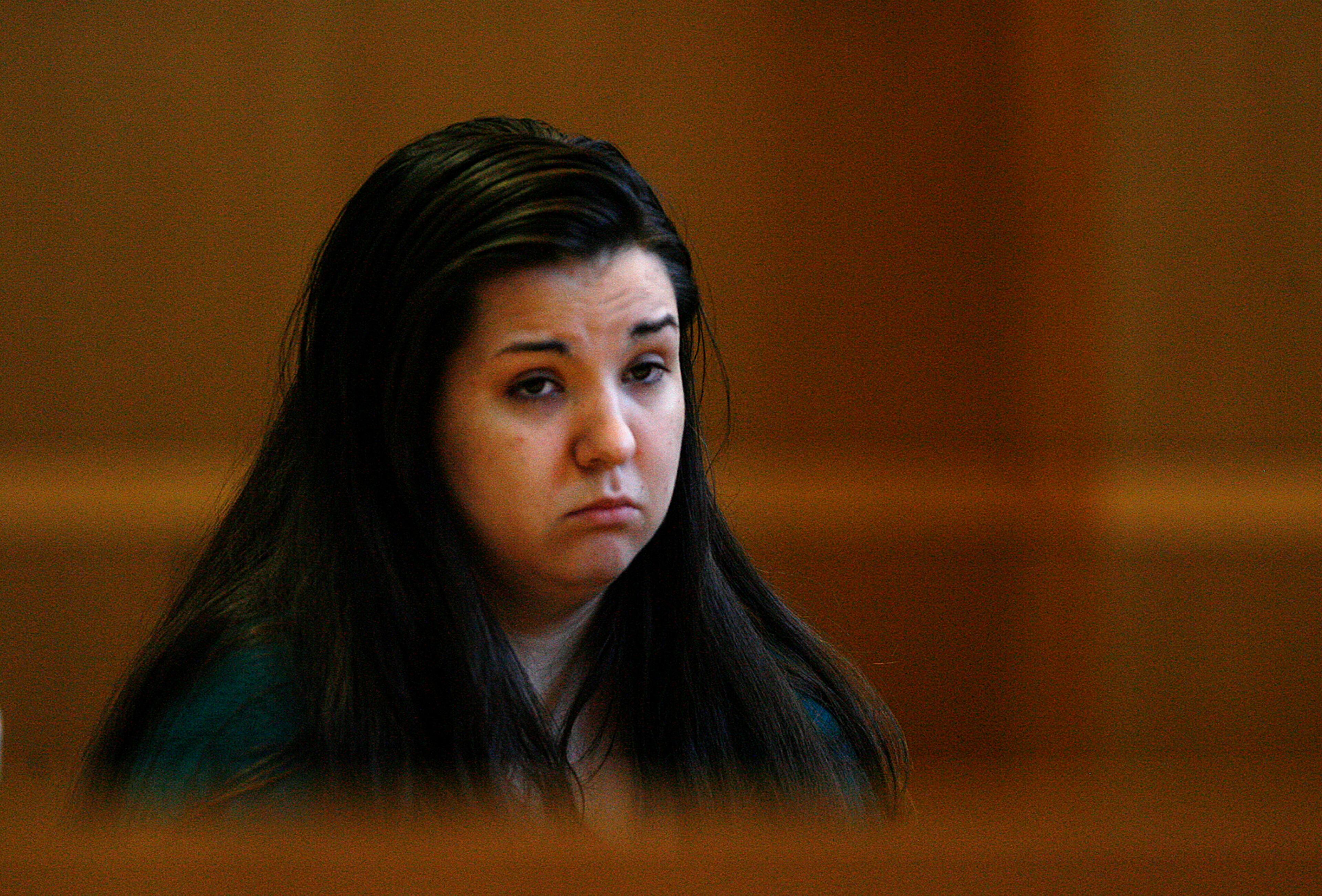 Jennifer Mee, center, looks at potential jurors as jury selection begins her murder trial, Tuesday, Sept. 17, 2013, at the Pinellas County Justice Center in Clearwater, Fla. Mee, 22, who found fame in 2007 as a teen because of her uncontrollable hiccupping, is charged with first-degree murder in the 2010 death of Shannon Griffin. (AP Photo/The Tampa Bay Times, Scott Keeler, Pool)