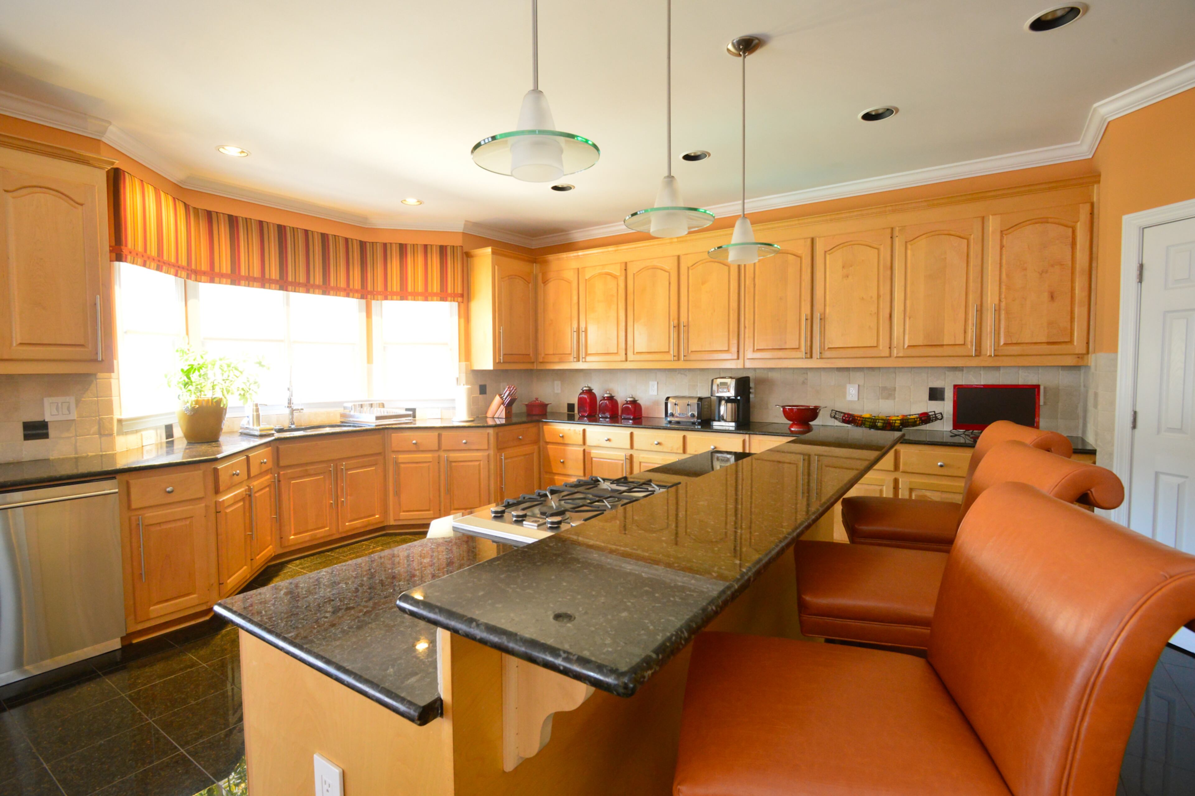 The Mitchell children - Maya and Sean --- often study and complete school assignments at what mom Shawn Evans Mitchell calls the "homework bar." The kitchen also features granite tile on the floor, granite countertops and Viking stainless steel appliances.