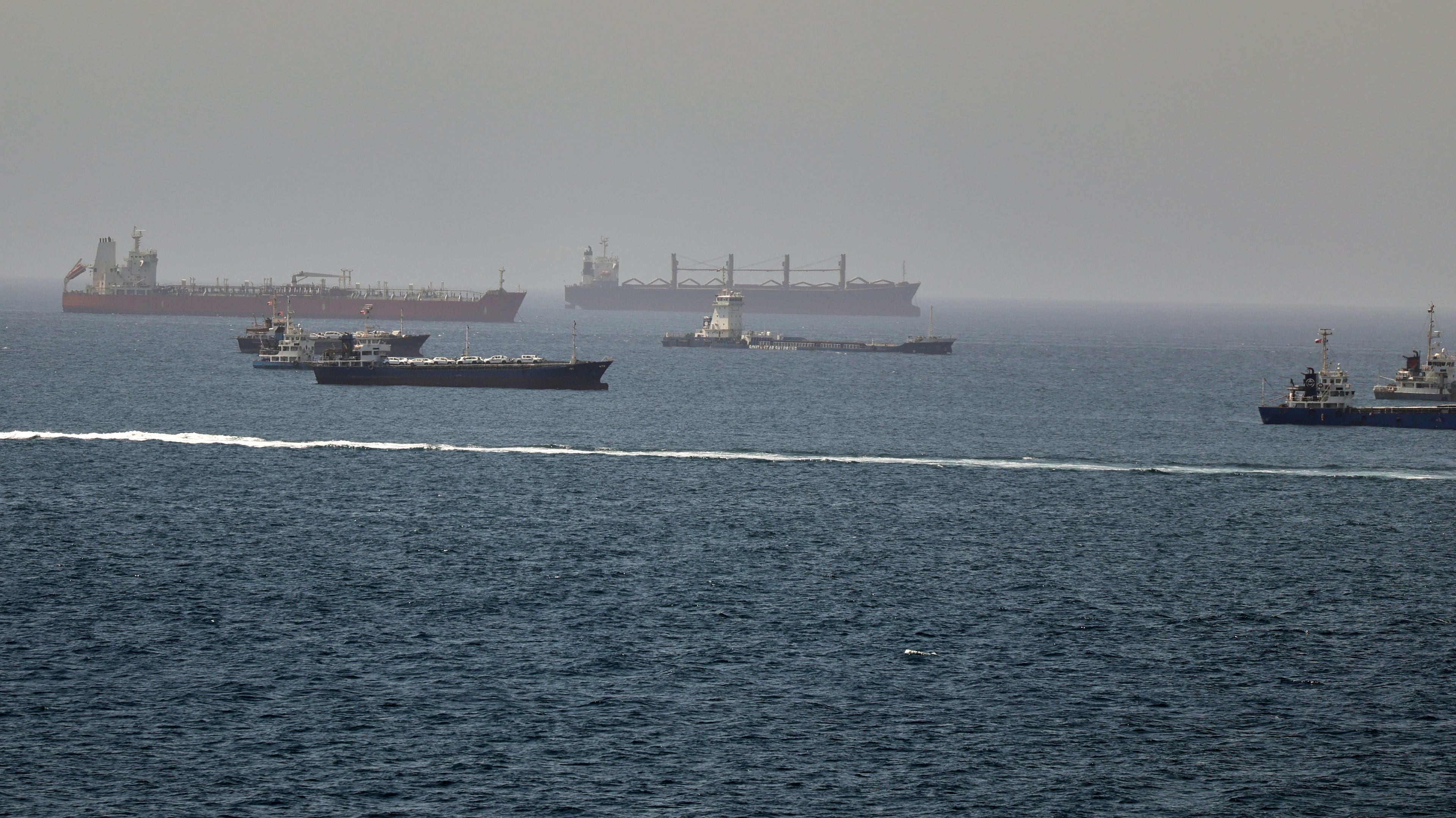 Tankers and cargo vessels are seen in the Gulf of Oman, along shipping routes linking the Strait of Hormuz and the Arabian Sea, Tuesday, June 16, 2026. (AP Photo)