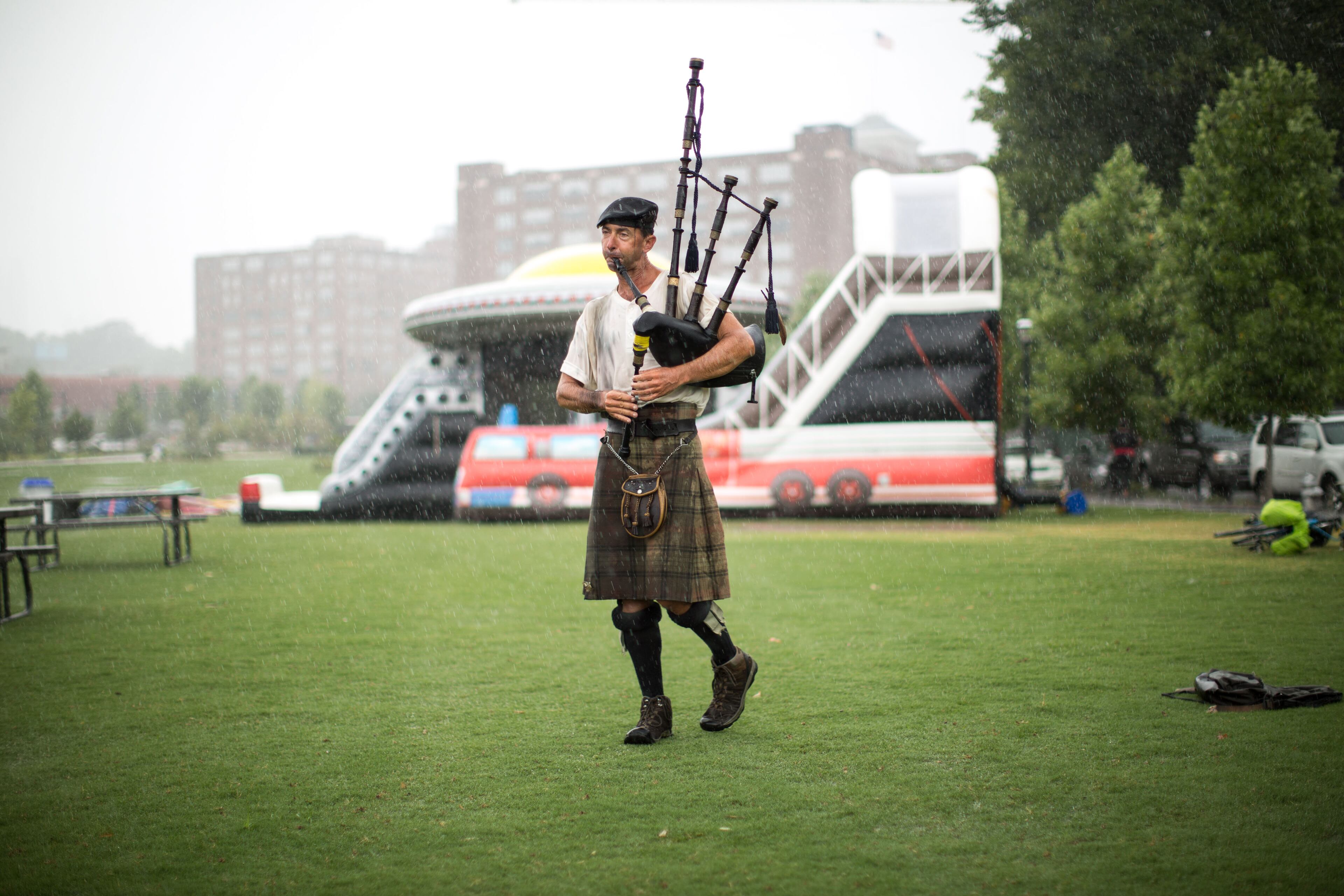 Timothy Wade plays the bag pipes in the rain during the Old Fourth Ward Park Arts Festival, Saturday, June 27, 2015, in Atlanta. BRANDEN CAMP/SPECIAL