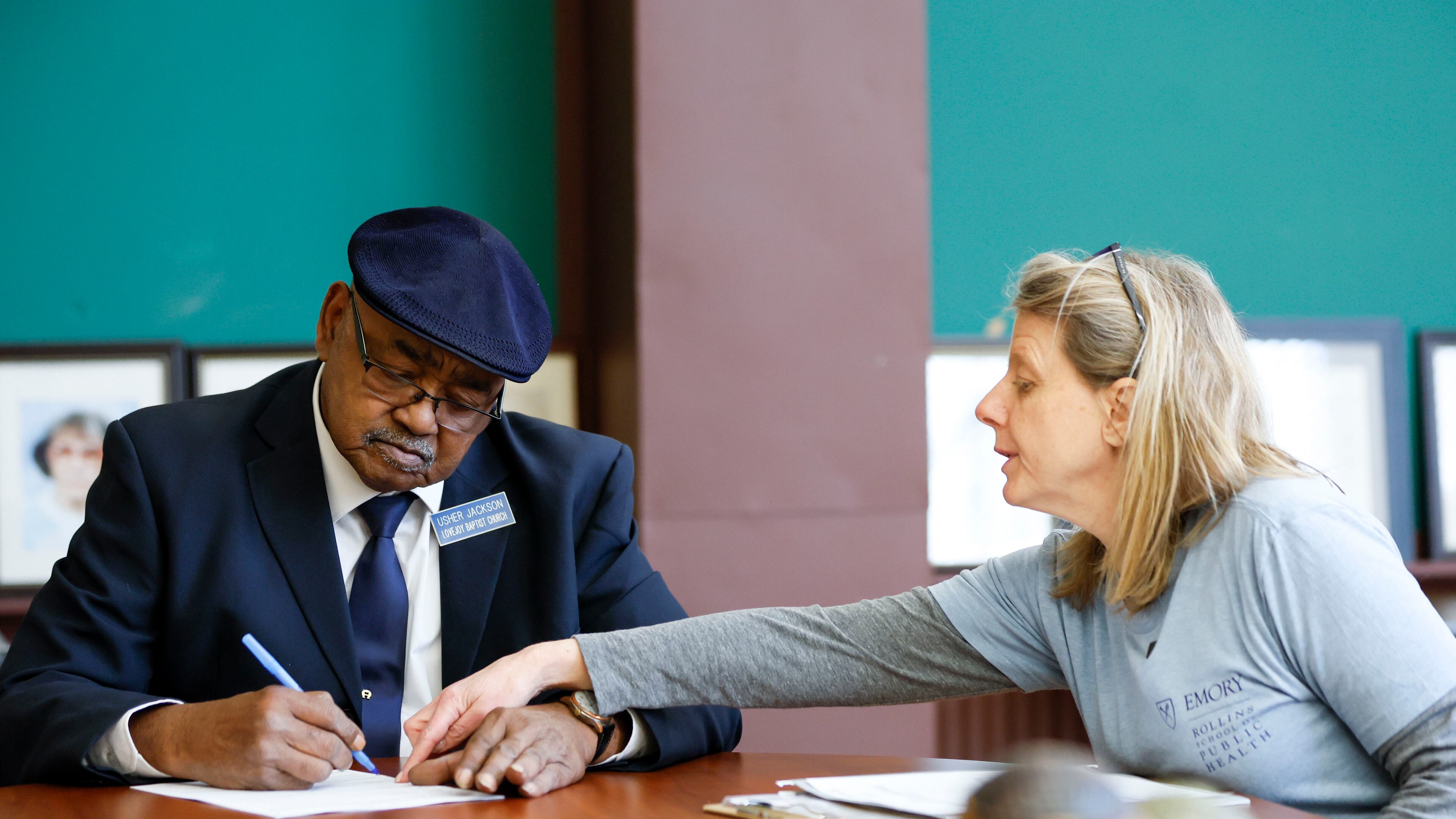 Emory researcher Melanie Pearson presents documents to Rome resident Alvin Jackson on Sunday, February 2, 2025, for approval to participate in a study that aims to identify PFAS, commonly referred to as “forever chemicals,” through blood screening.
(Miguel Martinez/ AJC)