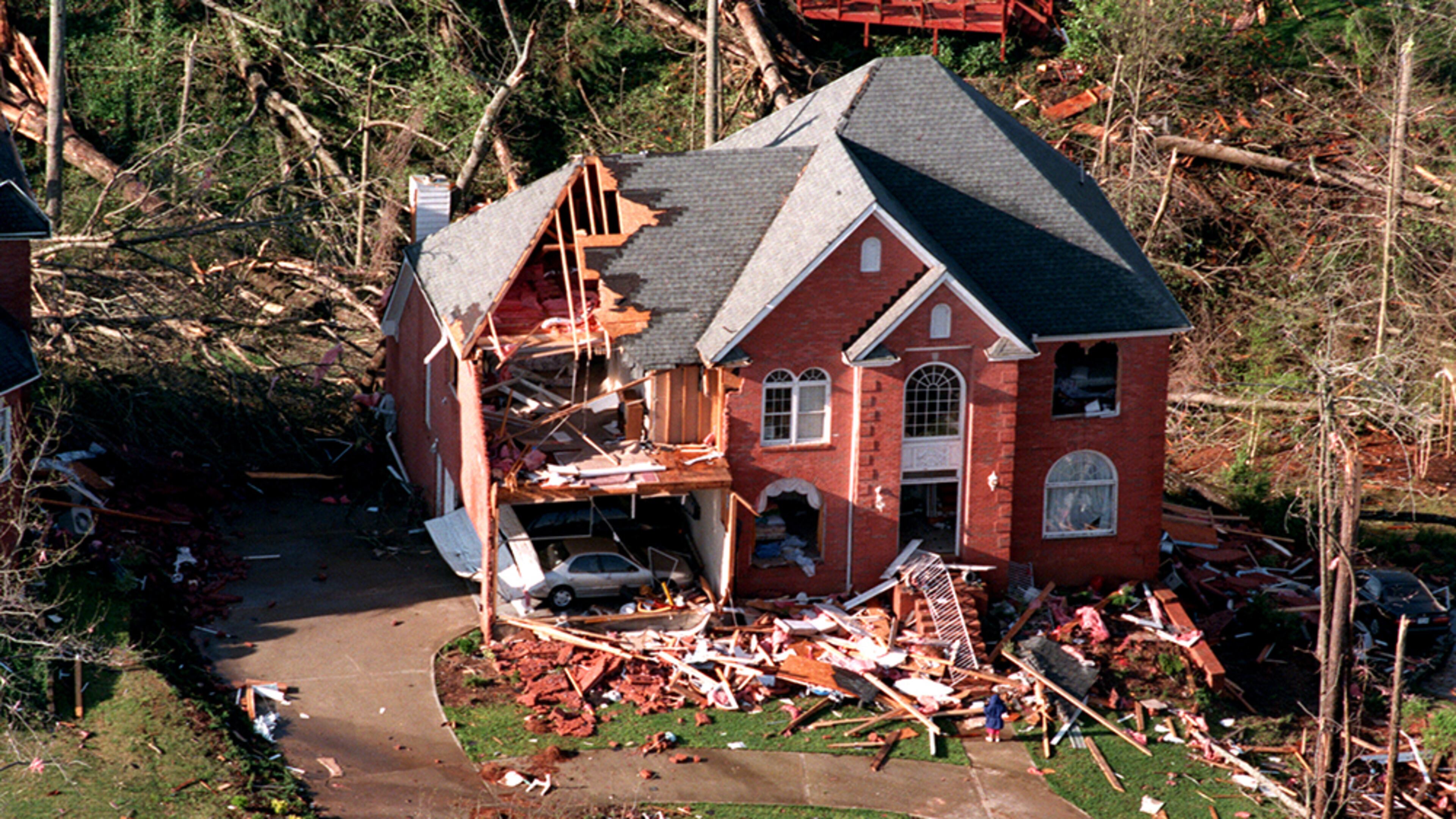 1998 DUNWOODY TORNADO: Homes in Dunwoody, Norcross, Sandy Springs, Duluth and Smyrna were destroyed or seriously damaged, and 60,000 trees were uprooted. (Phil Skinner / AJC file)