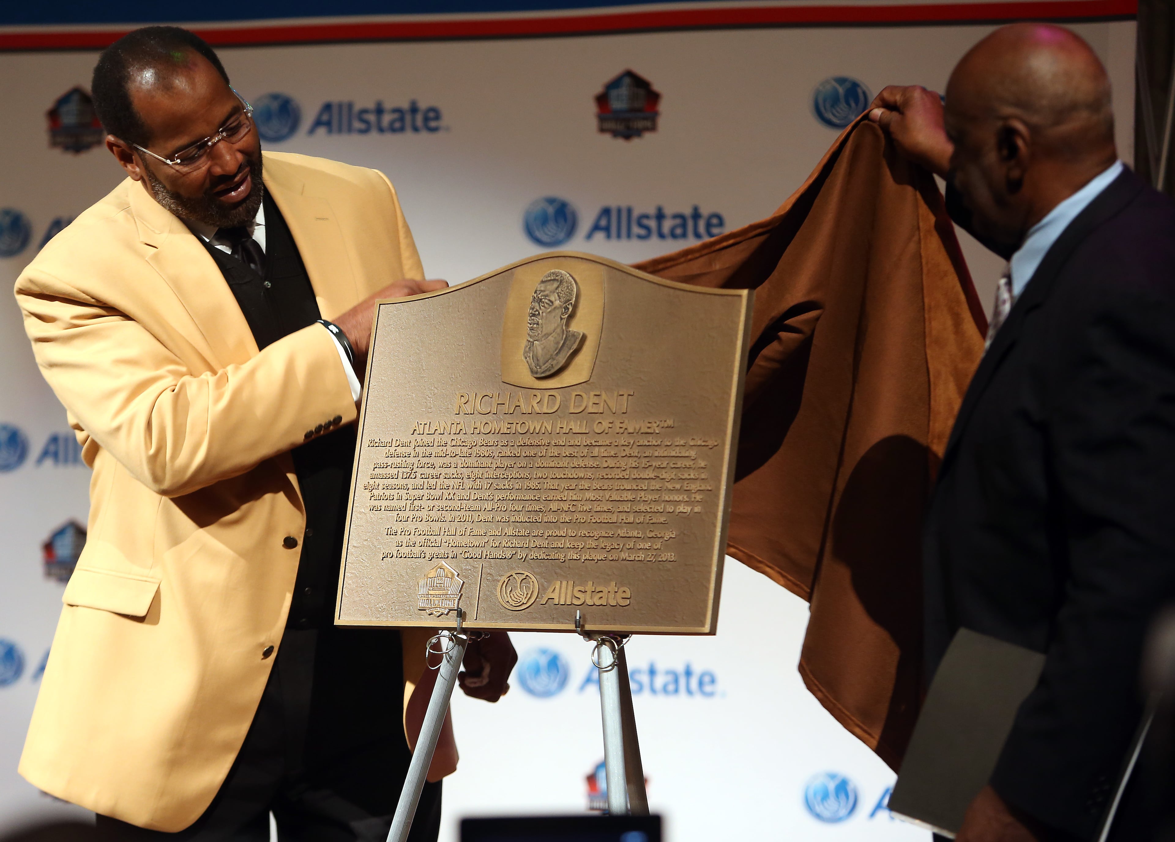 Dent and former coach Henry Adams unveil the historical plaque.