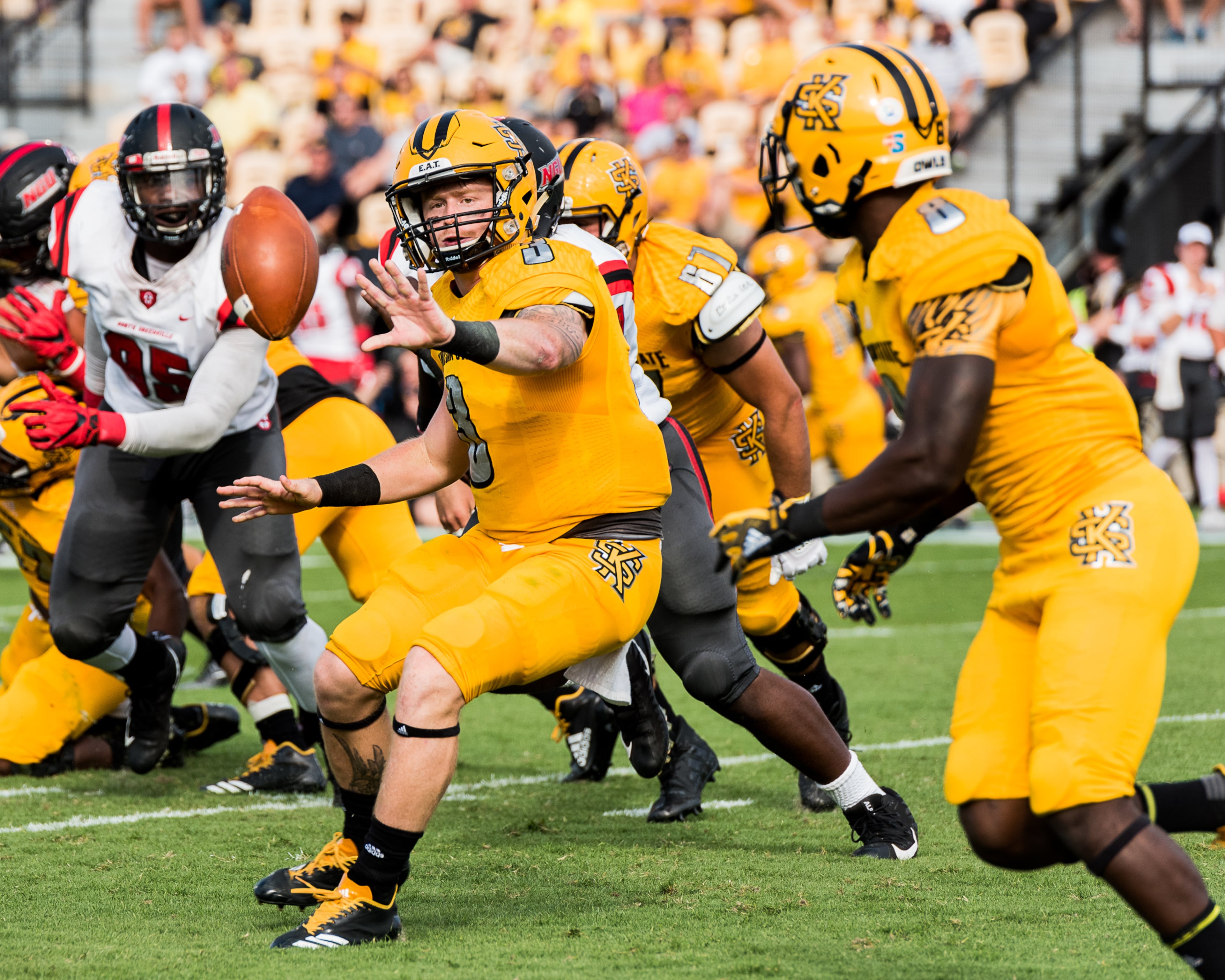 Kennesaw State's Chandler Burks (3) pitches to running back TJ Reed (8) during Saturday's matchup between Kennesaw State and North Greenville, Saturday, Sept. 30, 2017. (Special by Cory Hancock)