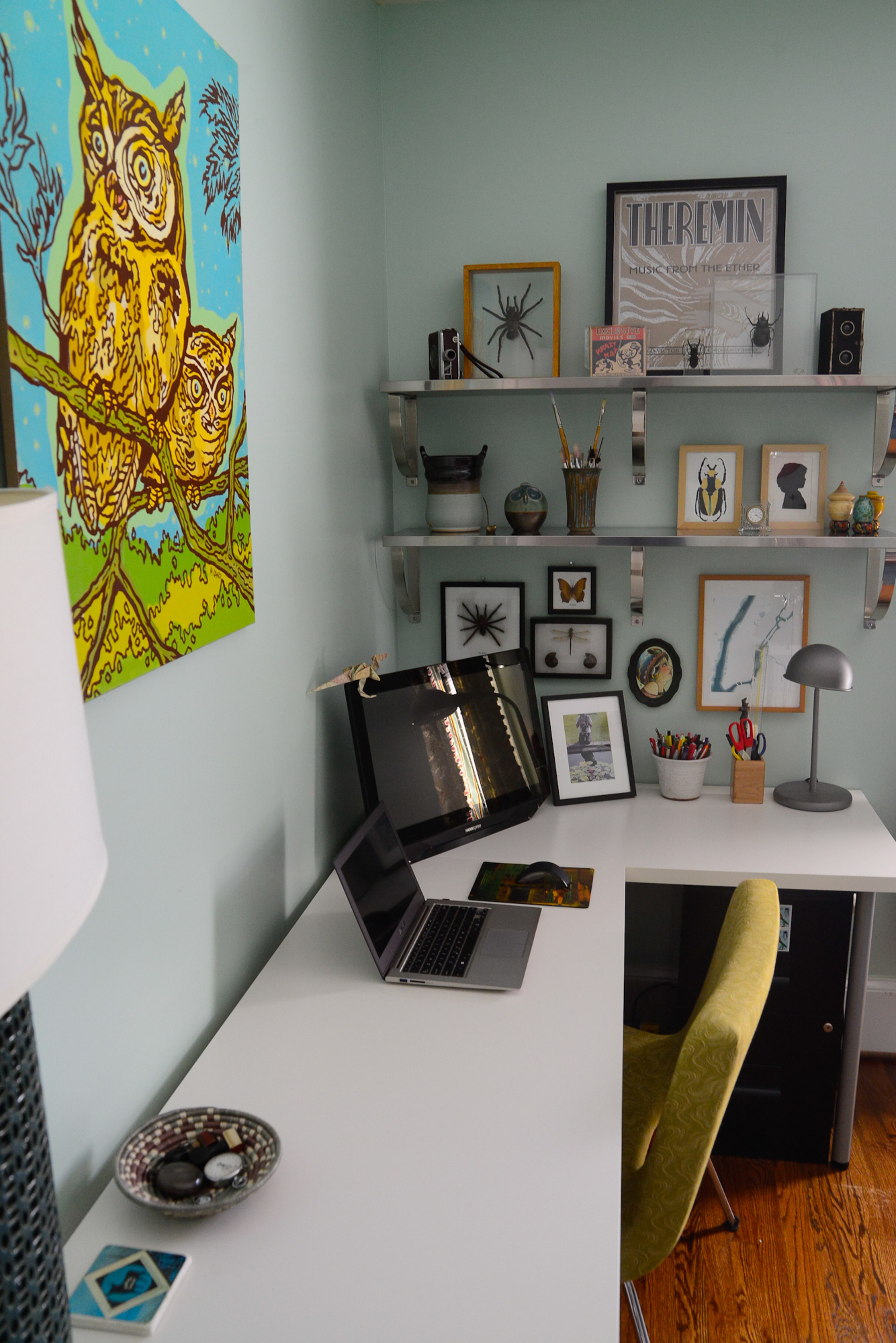 The office features a piece called "Great Horned Owls" by local artist R. Land.