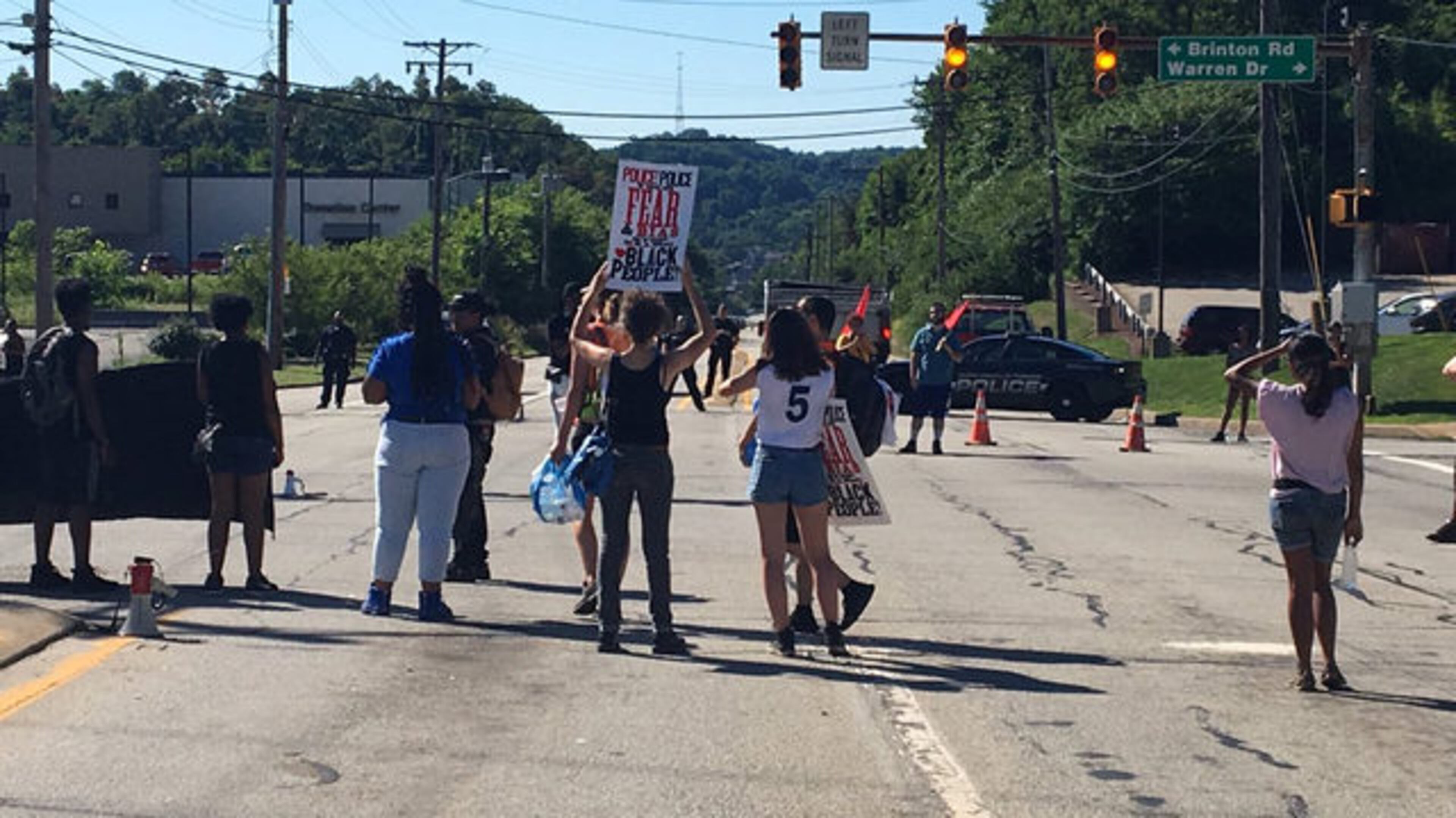 Protesters closed a road but were hit when a driver ran his car through. (Photo: WPXI.com)