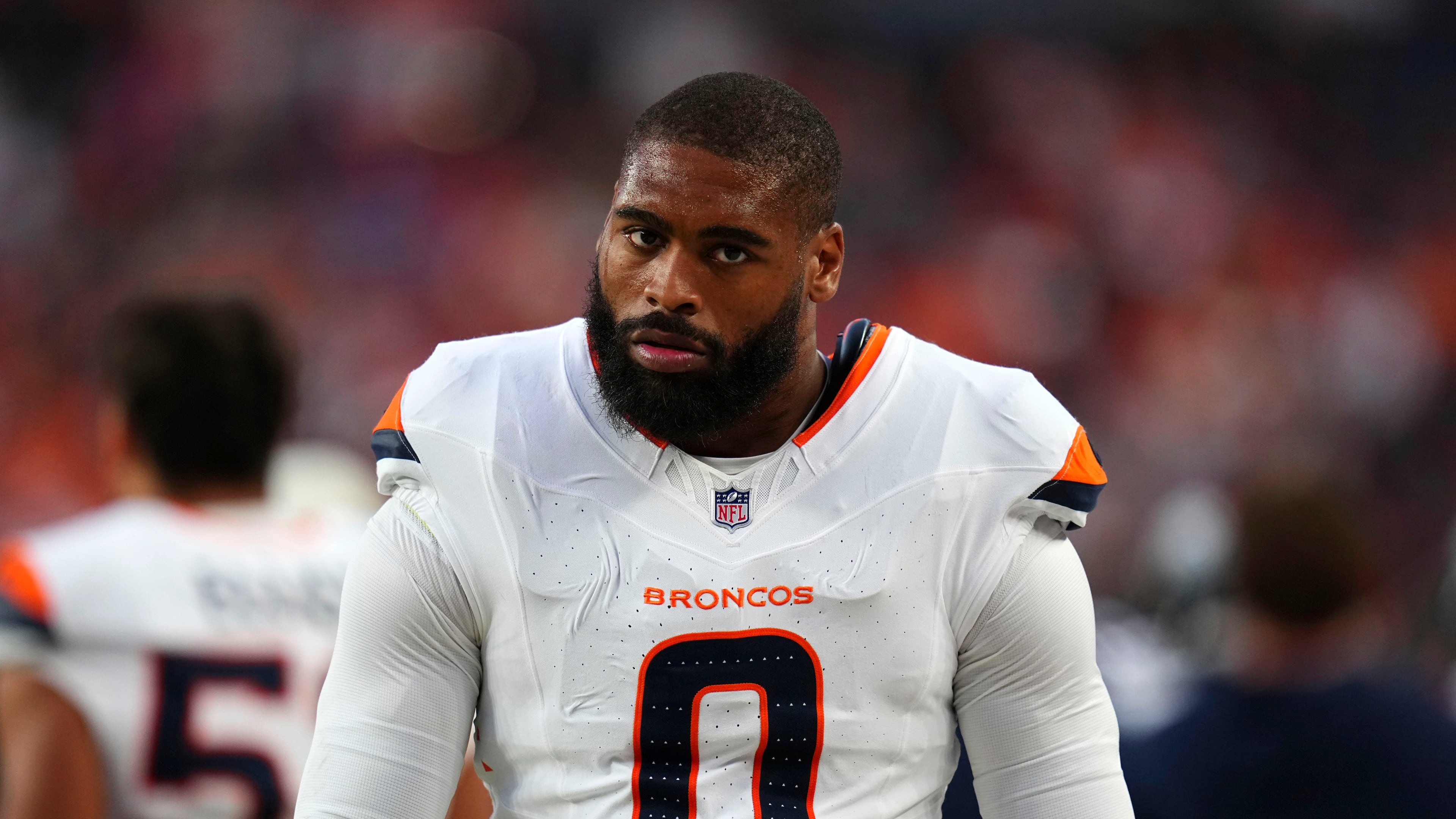 Denver Broncos linebacker Jonathon Cooper walks on the sideline during the first half of a preseason NFL football game against the Minnesota Vikings, Friday, Aug. 28, 2026, in Denver. (AP Photo/Jack Dempsey)
