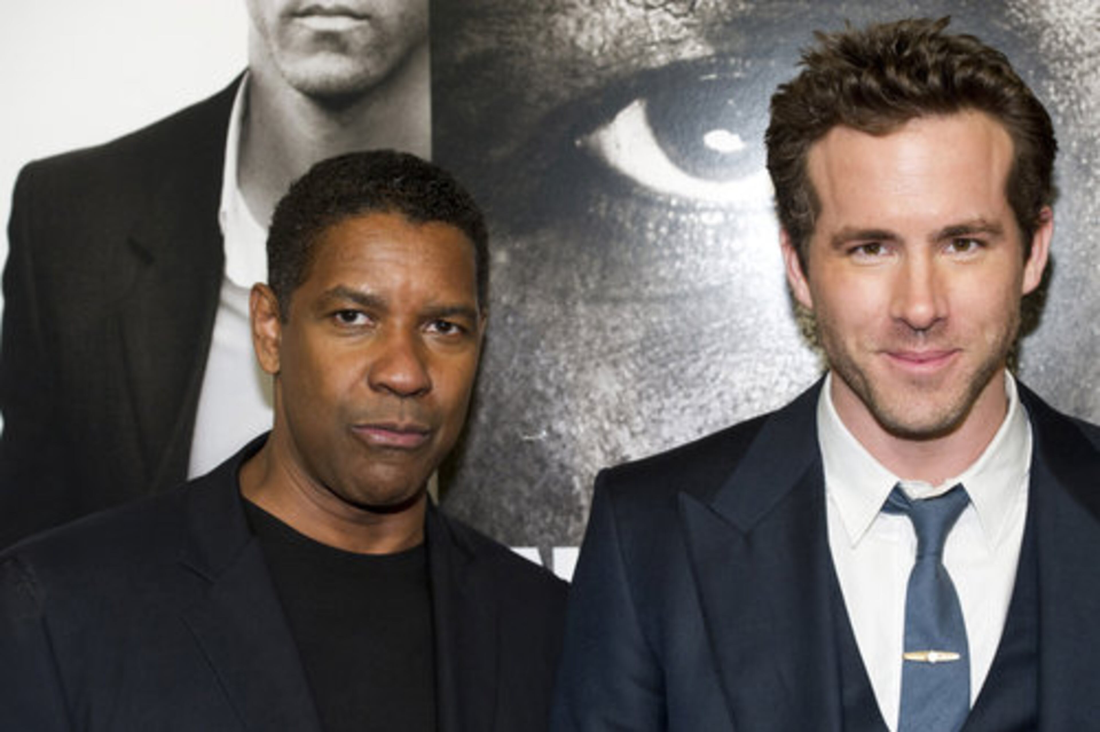 Co-stars Denzel Washington, left, and Ryan Reynolds attend the premiere of "Safe House."