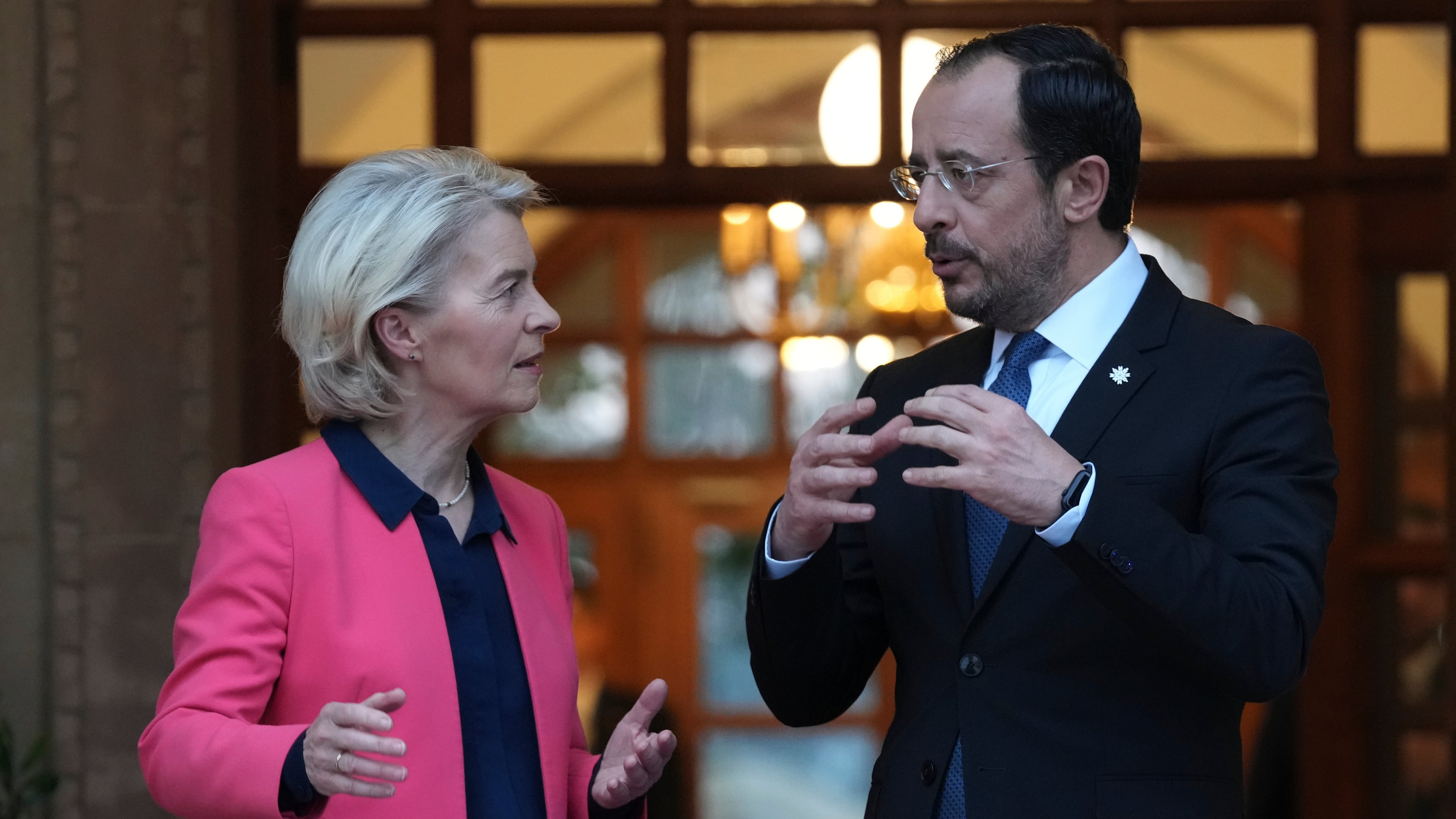 European Commission President Ursula von der Leyen, left, talks with Cyprus' President Nikos Christodoulides as she leaves after a meeting at the presidential palace in Nicosia, Cyprus, Wednesday, Jan. 7, 2026. (AP Photo/Petros Karadjias, Pool)