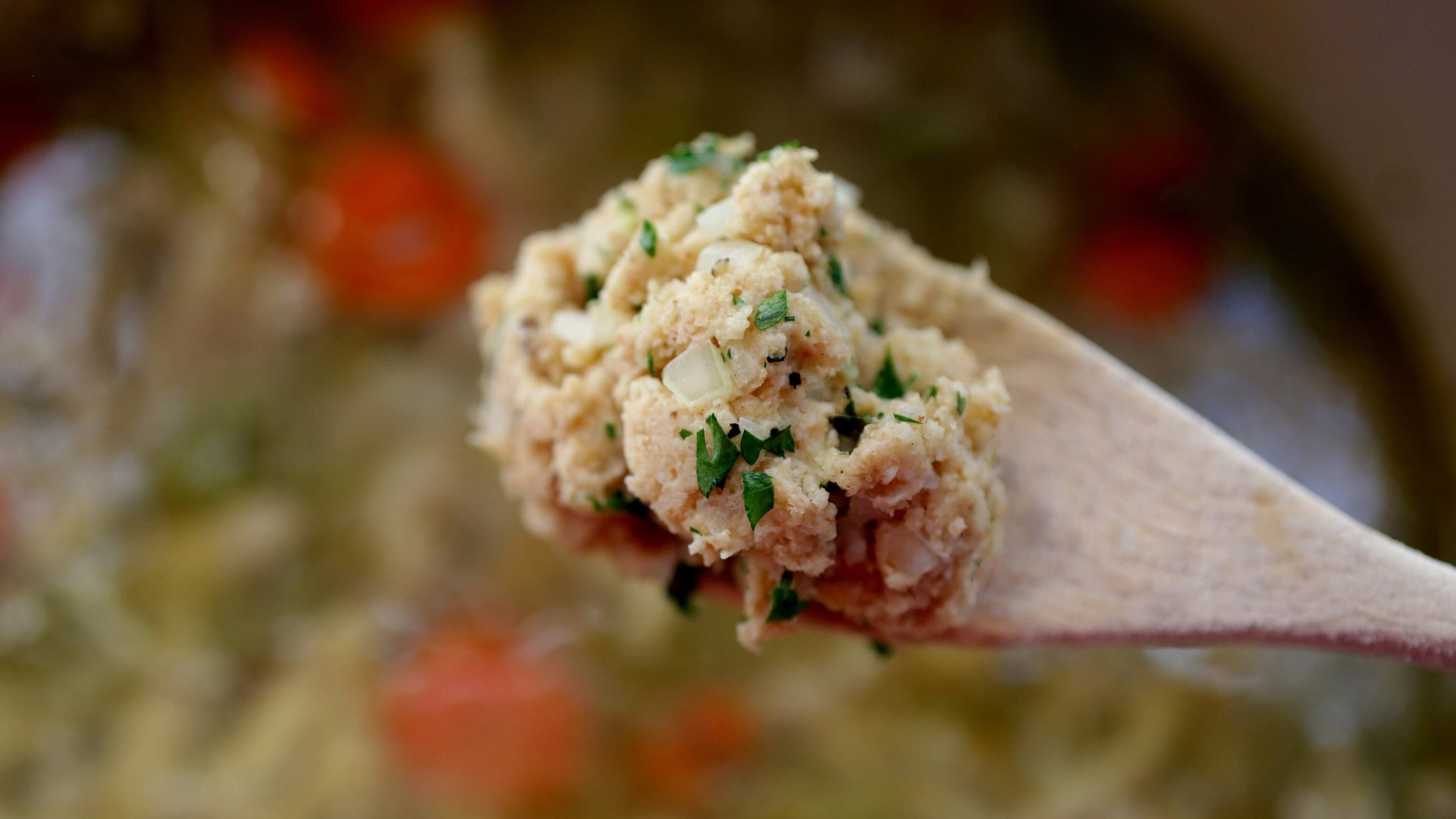 A spoonful of dumpling dough poised above the pot of chicken and dumplings. (Hillary Levin/St. Louis Post-Dispatch/TNS)