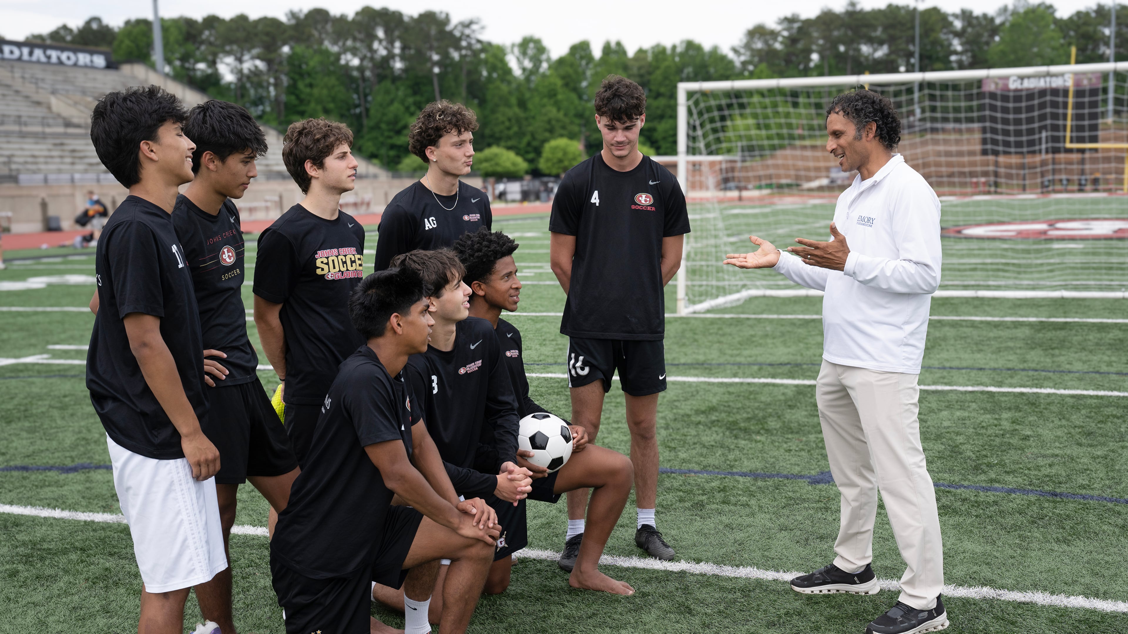 Dr. Neeru Jayanthi serves as the team physician for the Johns Creek High School men’s soccer team, which won its first Class 5A state championship this spring. (Courtesy of Jack Kearse/Emory University)