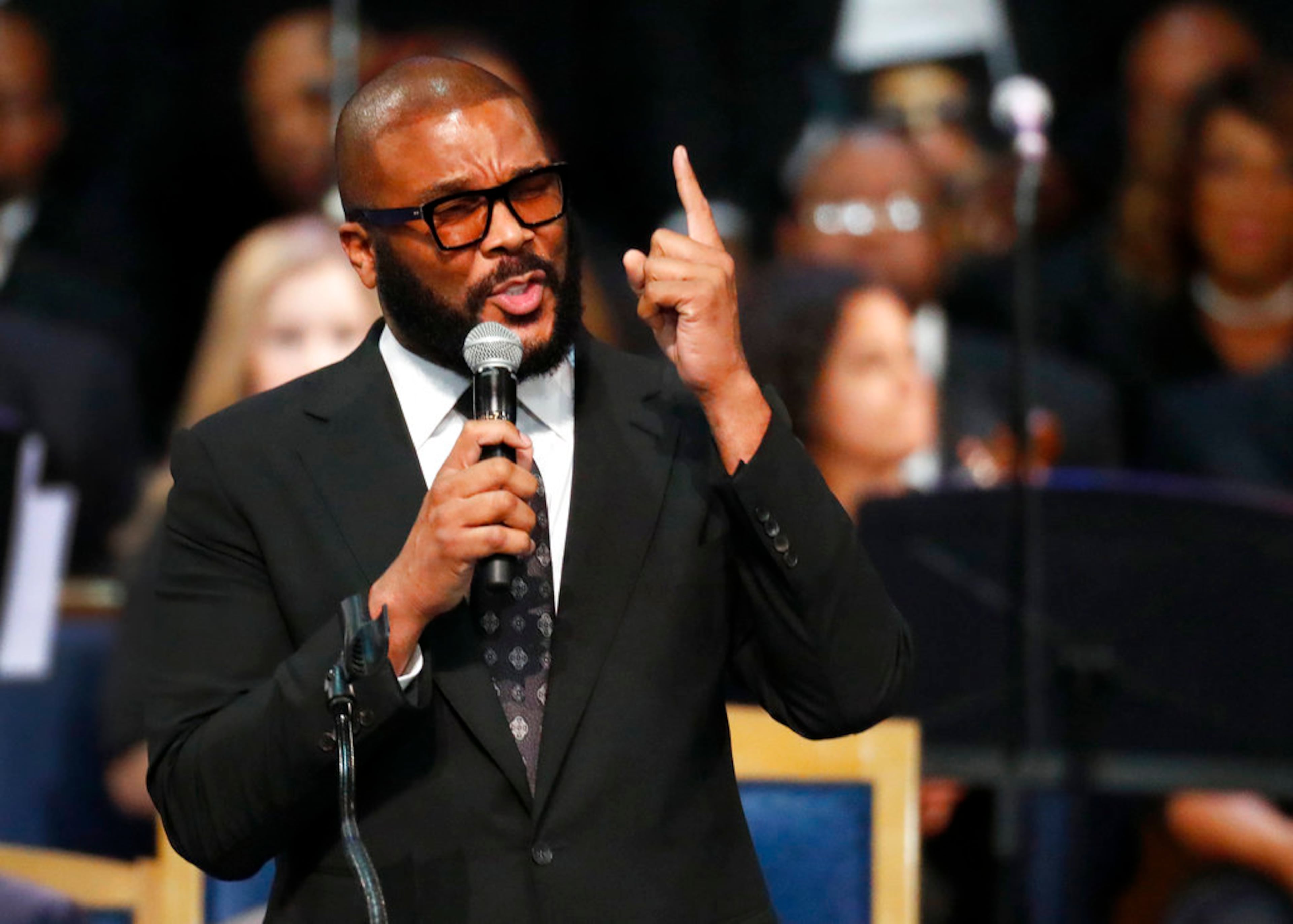 Tyler Perry speaks during the funeral service for Aretha Franklin at Greater Grace Temple, Friday, Aug. 31, 2018, in Detroit. Franklin died Aug. 16, 2018 of pancreatic cancer at the age of 76. (AP Photo/Paul Sancya)