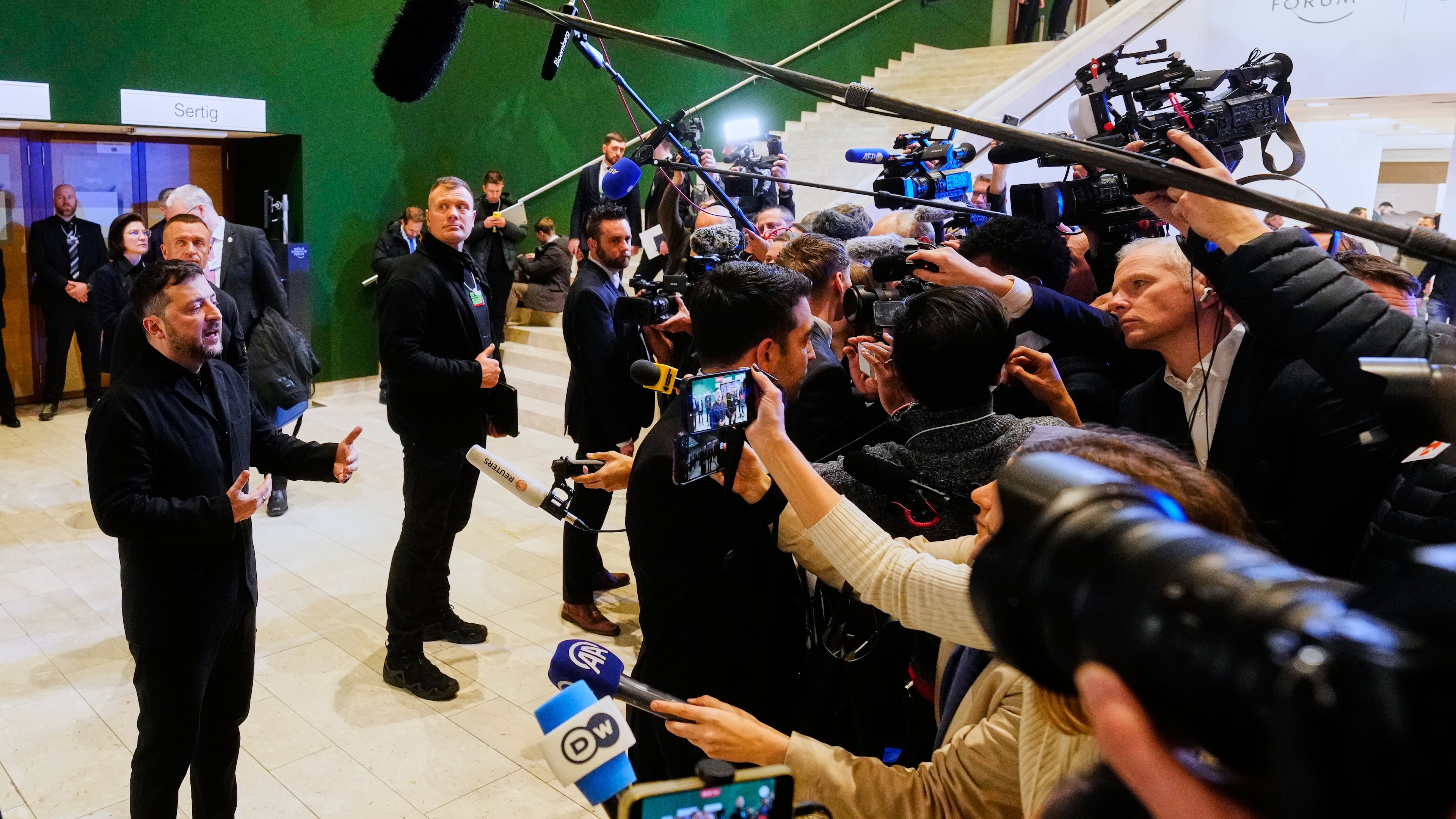 Ukraine's President Volodymyr Zelenskyy talks to the media at the Annual Meeting of the World Economic Forum in Davos, Switzerland, Thursday, Jan. 22, 2026. (AP Photo/Markus Schreiber)