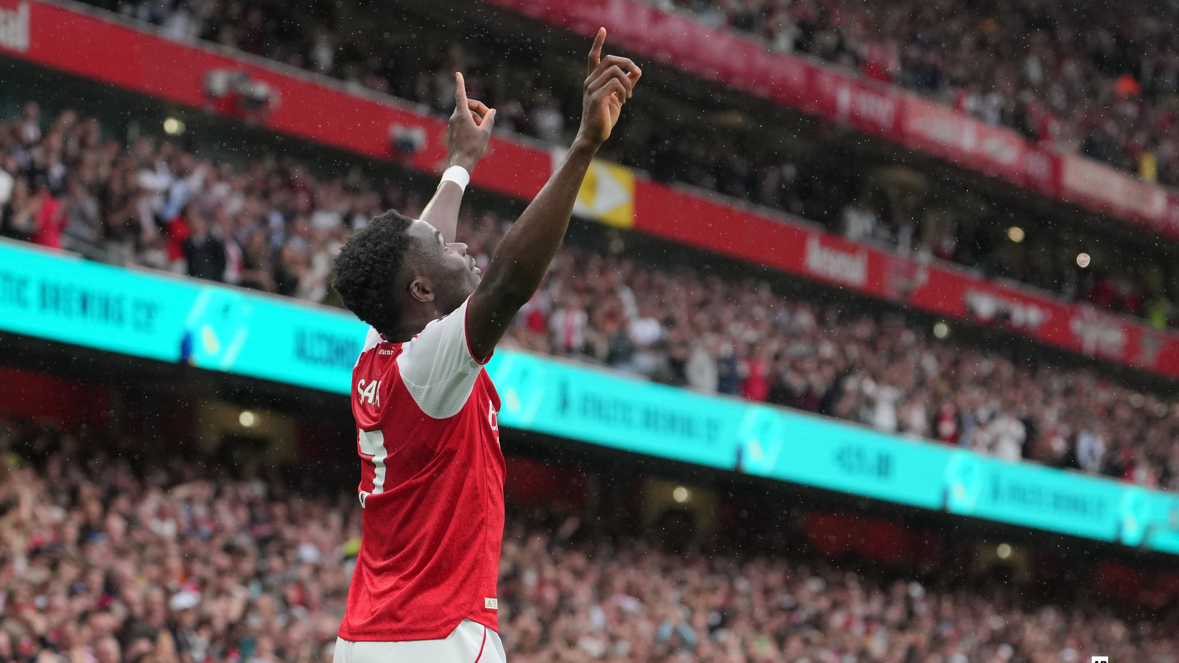 Arsenal's Bukayo Saka celebrates after scoring his side's second goal during the English Premier League soccer match between Arsenal and Fulham in London, England, Saturday, May 2, 2026. (AP Photo/Kin Cheung)