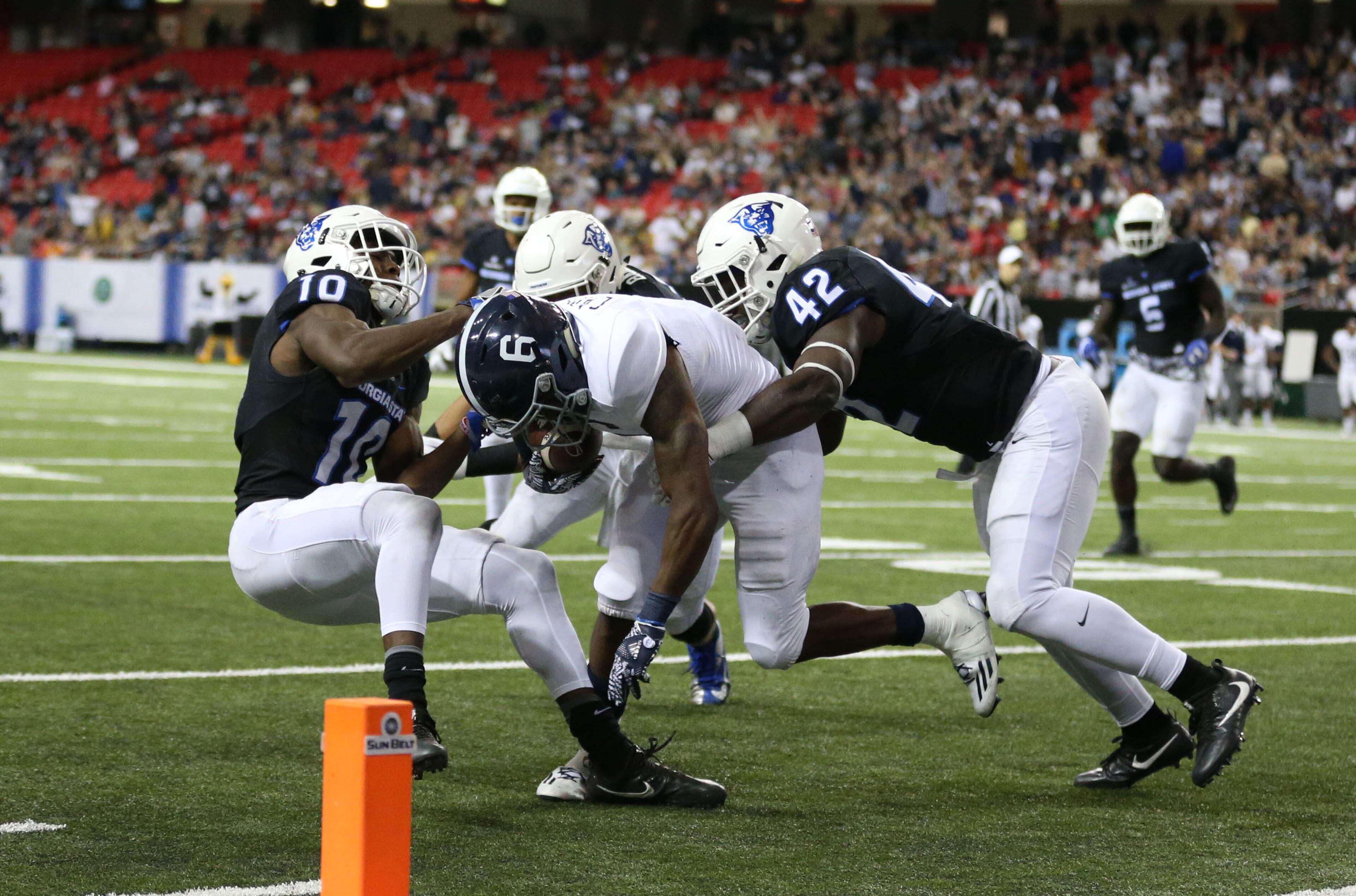 November 19, 2016 - Atlanta, Ga: Georgia Southern Eagles wide receiver Myles Campbell (6) is brought down short of the goal line by Georgia State Panthers cornerback Chandon Sullivan (10) and linebacker Trey Payne (42) in the second half of their game at the Georgia Dome Saturday November 19, 2016, in Atlanta, Ga. Georgia State won 30-24. PHOTO / JASON GETZ