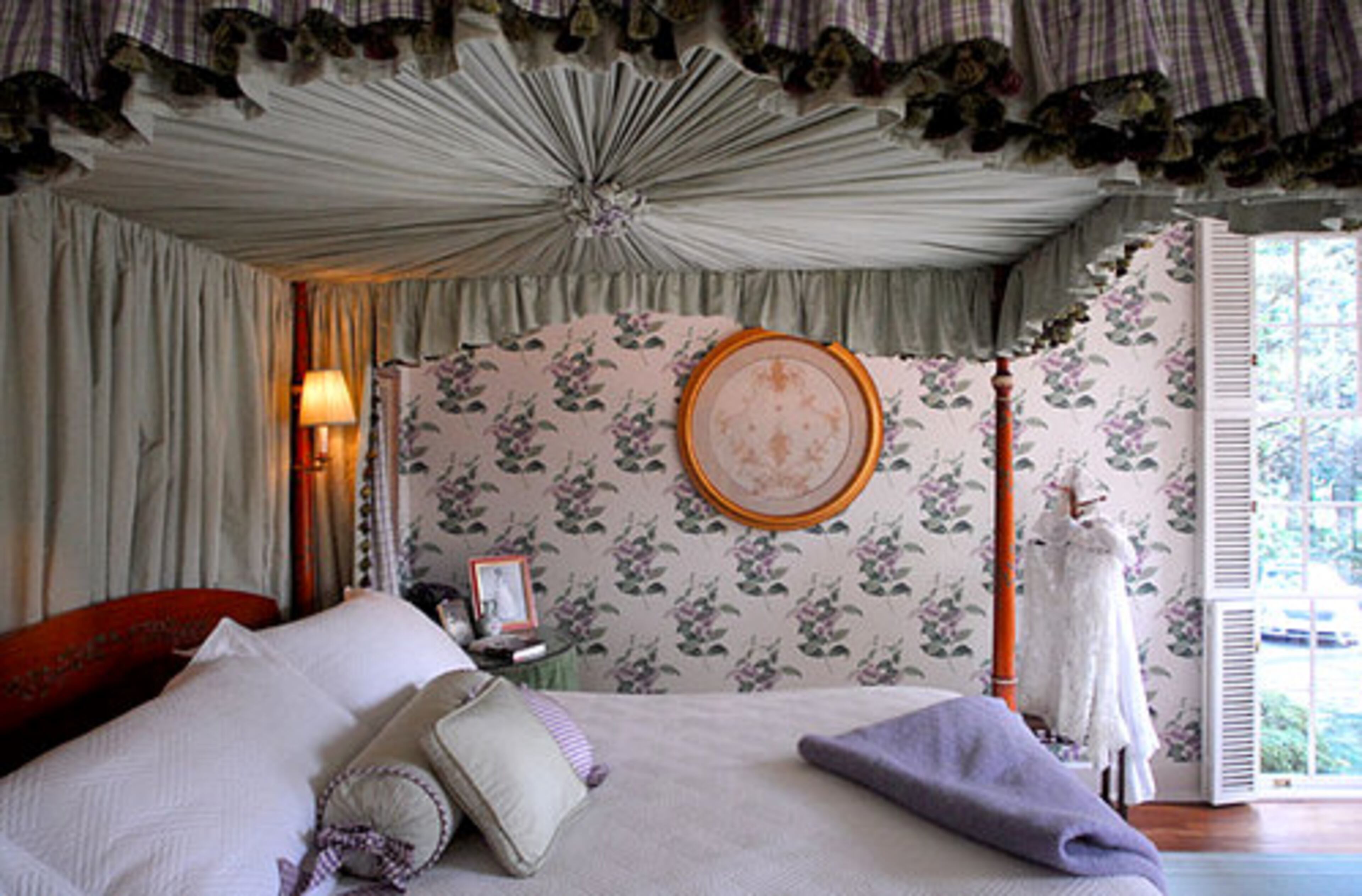 In the Textile Room, Anne Colgin framed a piece of her 1963 debutante gown. Also included is the wedding blouse from her marriage to Robbie Colgin three years ago. The lavender seen in the wisteria print wallpaper can be found throughout the room.