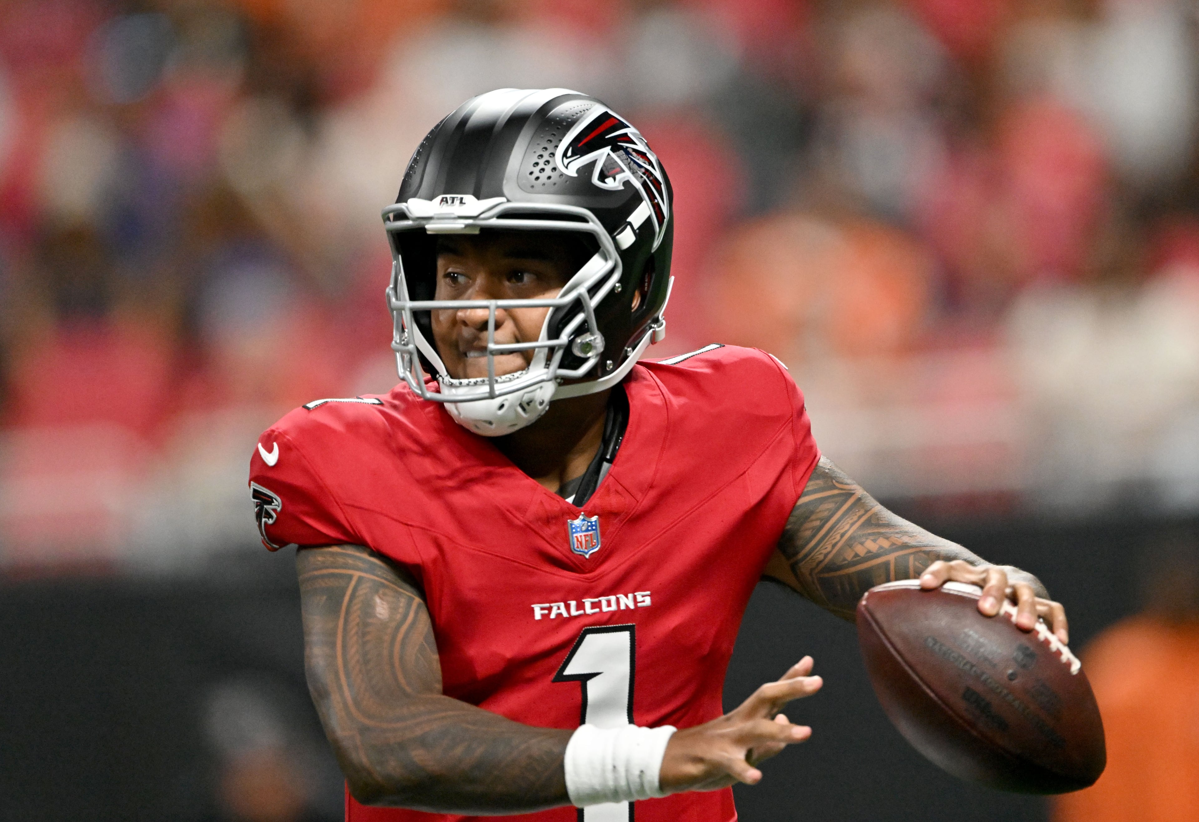 Falcons quarterback Tua Tagovailoa prepares to get off a pass during their preseason game against the Denver Broncos at Mercedes-Benz Stadium on Friday, Aug. 14, 2026, in Atlanta. (Hyosub Shin/AJC)