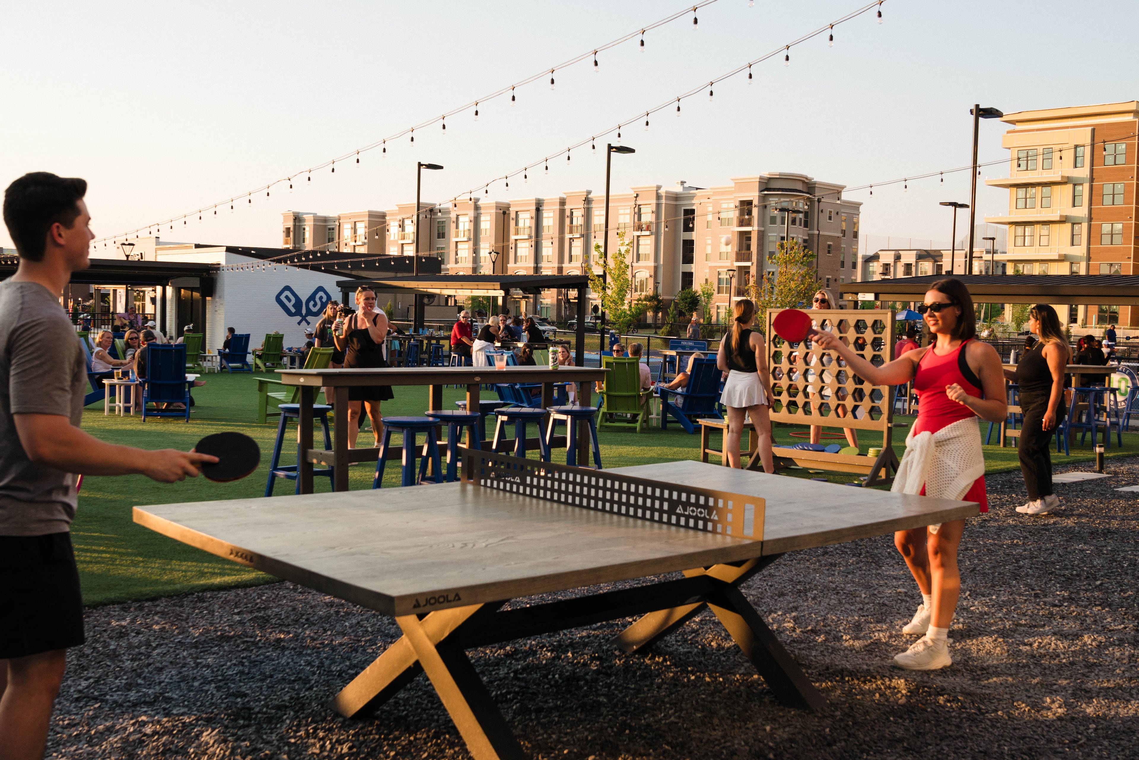 Socializing through pickleball is made even easier at venues like Pickle and Social, combining food, drinks, and live music with indoor and outdoor pickleball courts.