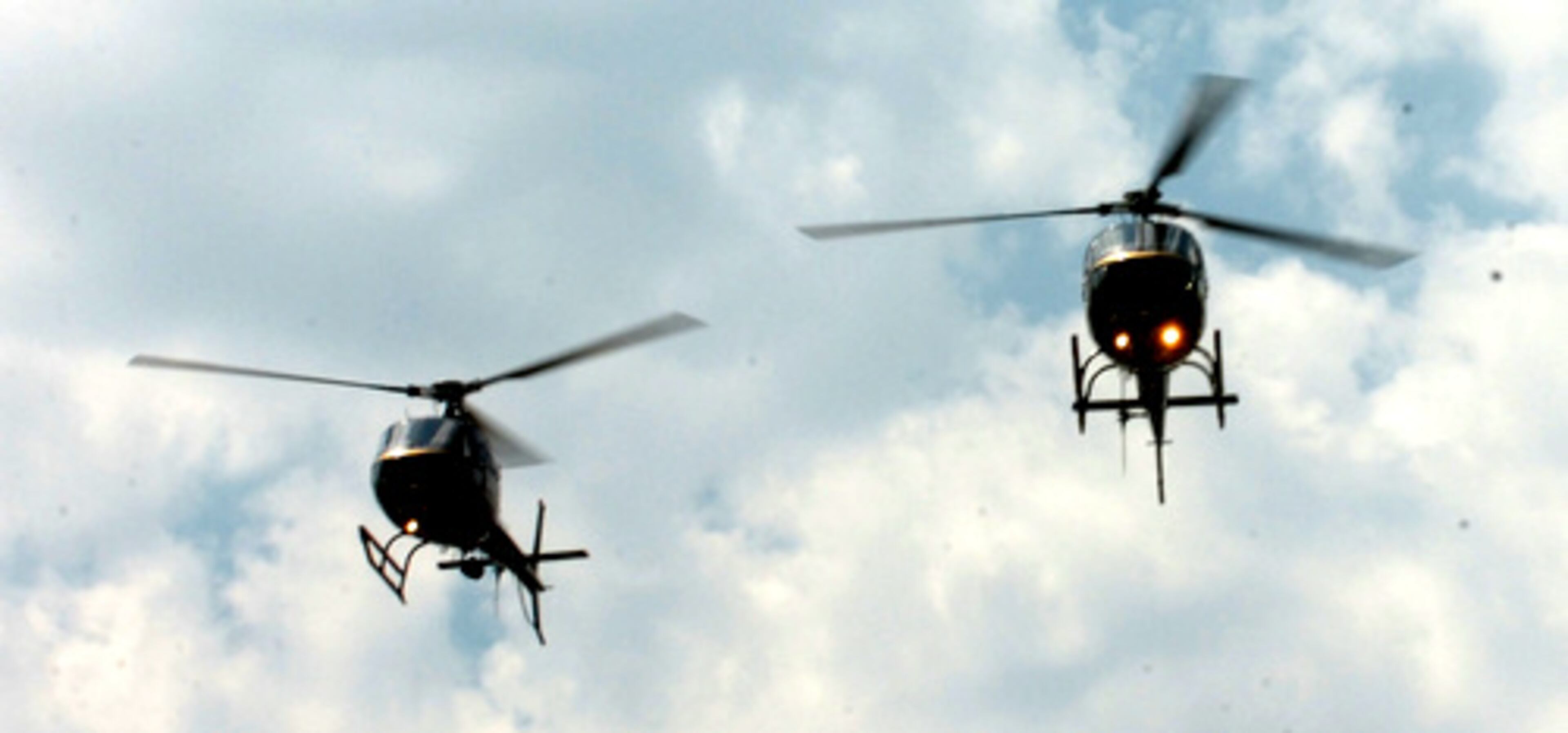 DeKalb police helicopters fly over during the memorial service.