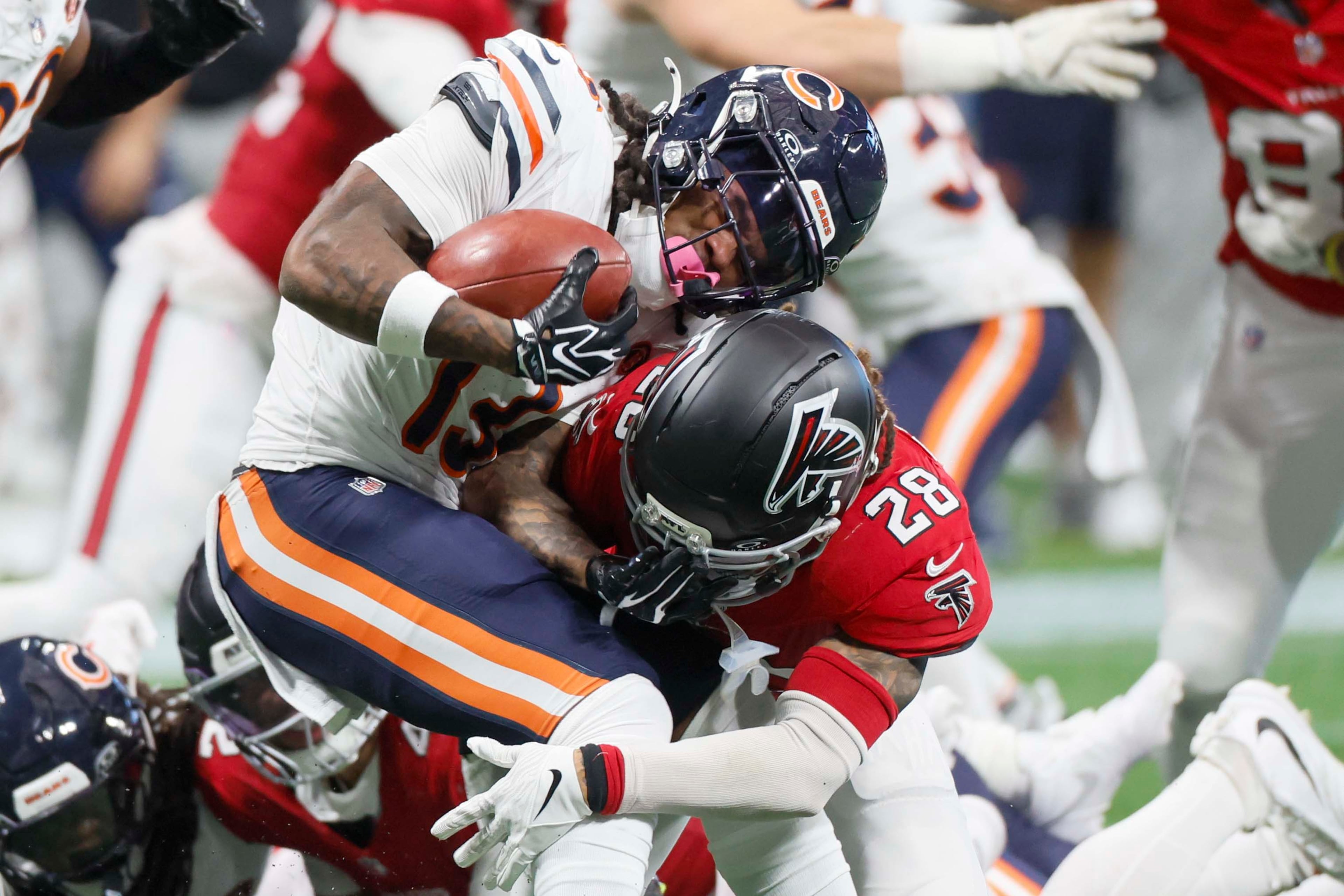 Atlanta Falcons defensive back Mike Ford Jr. tackles Chicago Bears wide receiver Zavion Thomas during the first half of an NFL game against the Chicago Bears at Mercedes-Benz Stadium in Atlanta on Sunday, Oct. 18, 2026. (Miguel Martinez/AJC)