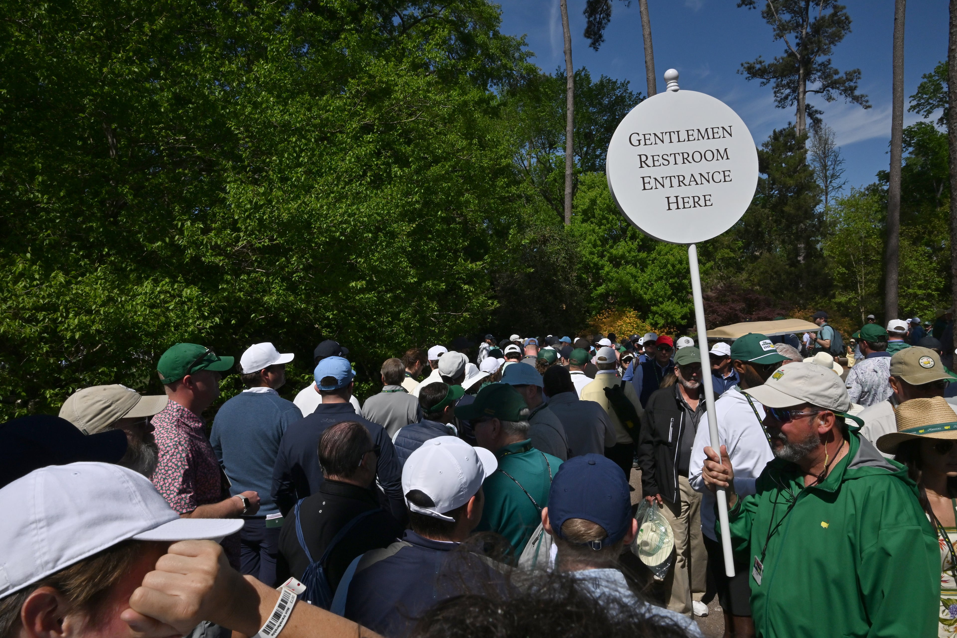Even the sign for for the men's restroom is handled by a person at Augusta National Golf Club. (Hyosub Shin/AJC)