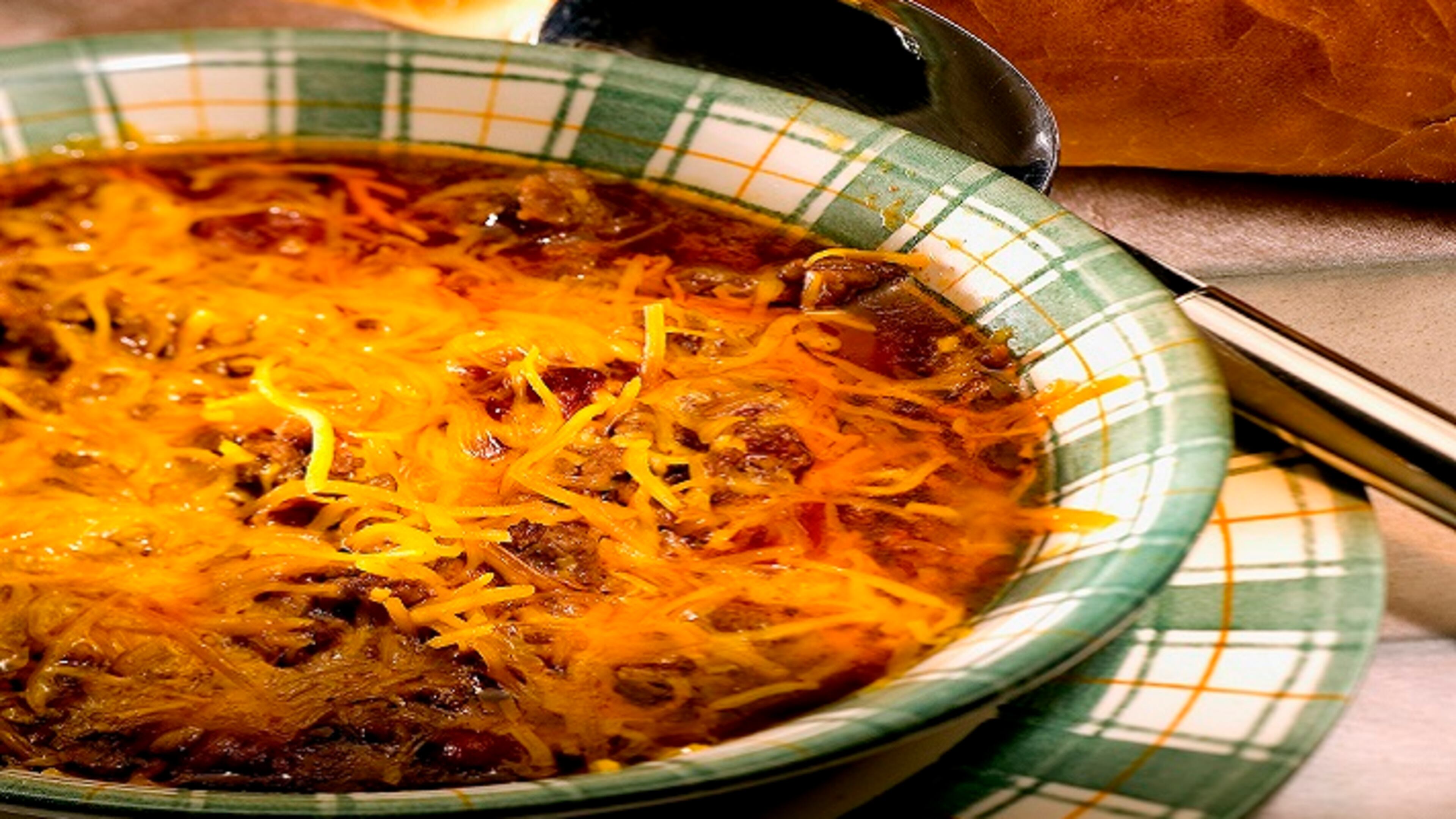 Hummingbird bean soup is flavored with chili powder and allspice, then topped with cheddar. (Bob Fila/Chicago Tribune/TNS)