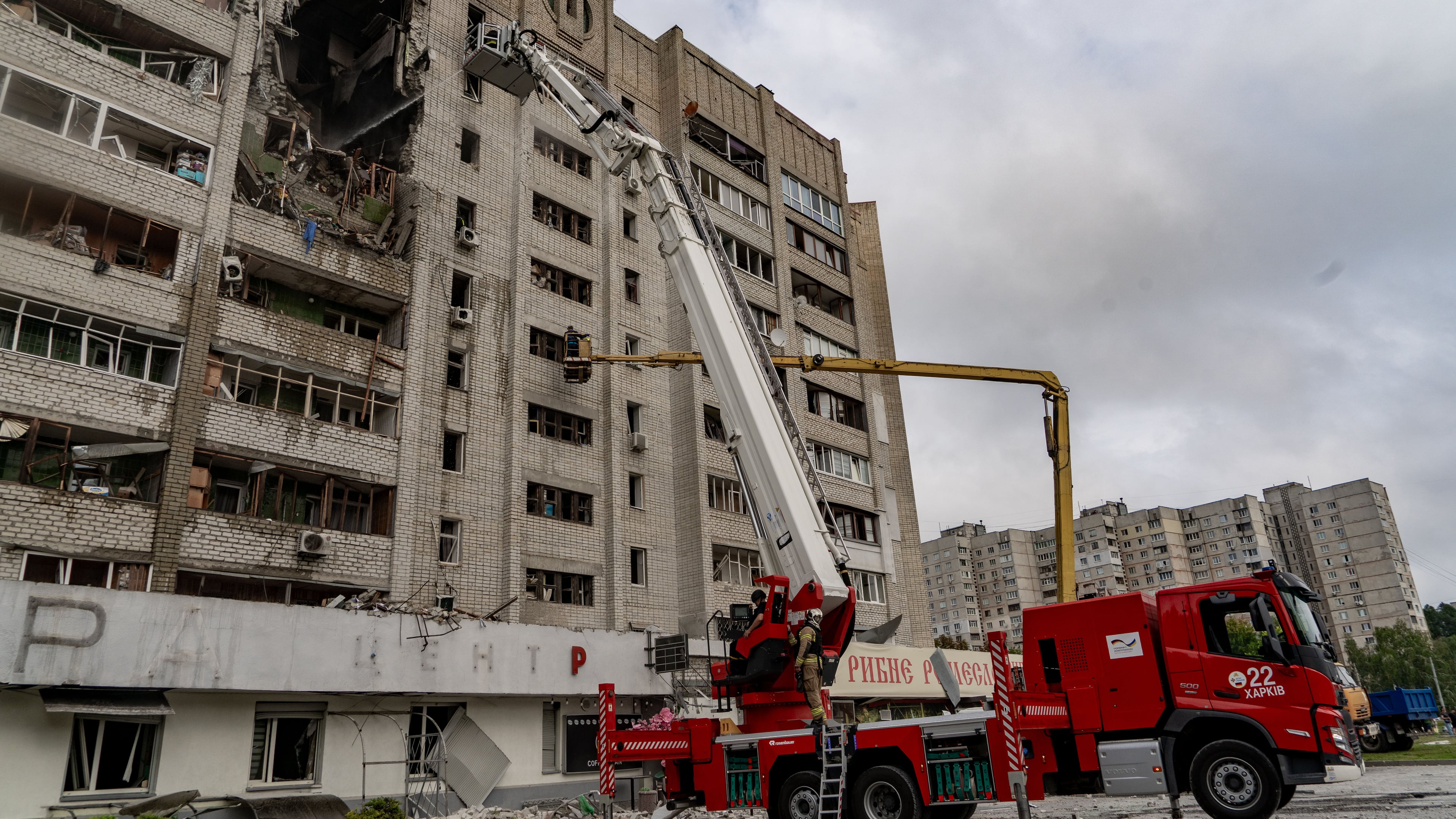 Firefighters put out a fire after a residential building was hit following Russia's drone attack in Kharkiv, Ukraine, Sunday, Aug. 9, 2026. (AP Photo/Andrii Marienko)