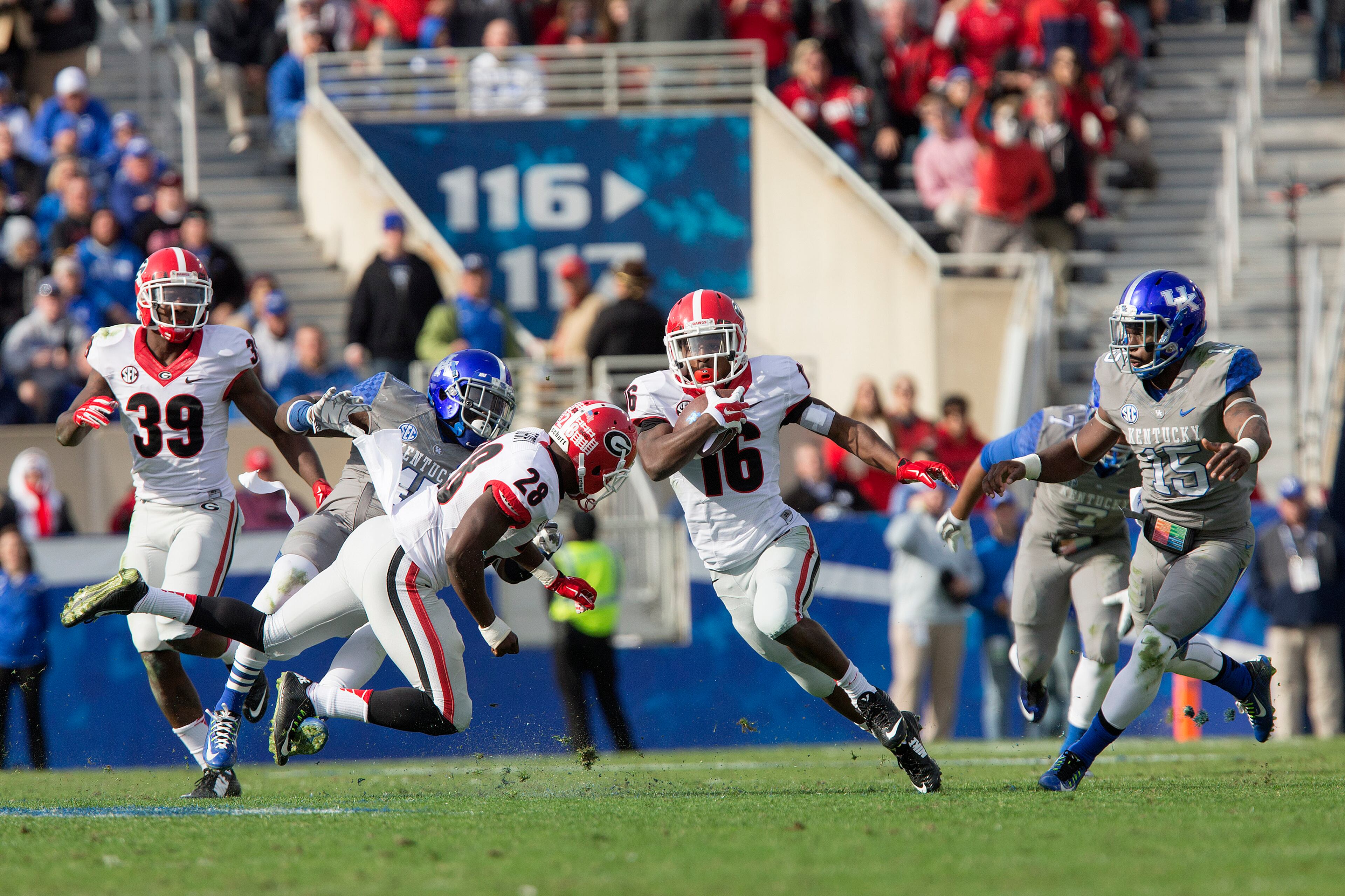 Georgia wide receiver Isaiah McKenzie runs for a touchdown on a 59-yard punt return during the second half of an NCAA college football game against Kentucky at Commonwealth Stadium in Lexington, Ky., Saturday, Nov. 8, 2014. Georgia beat Kentucky 63-31. (AP Photo/David Stephenson)