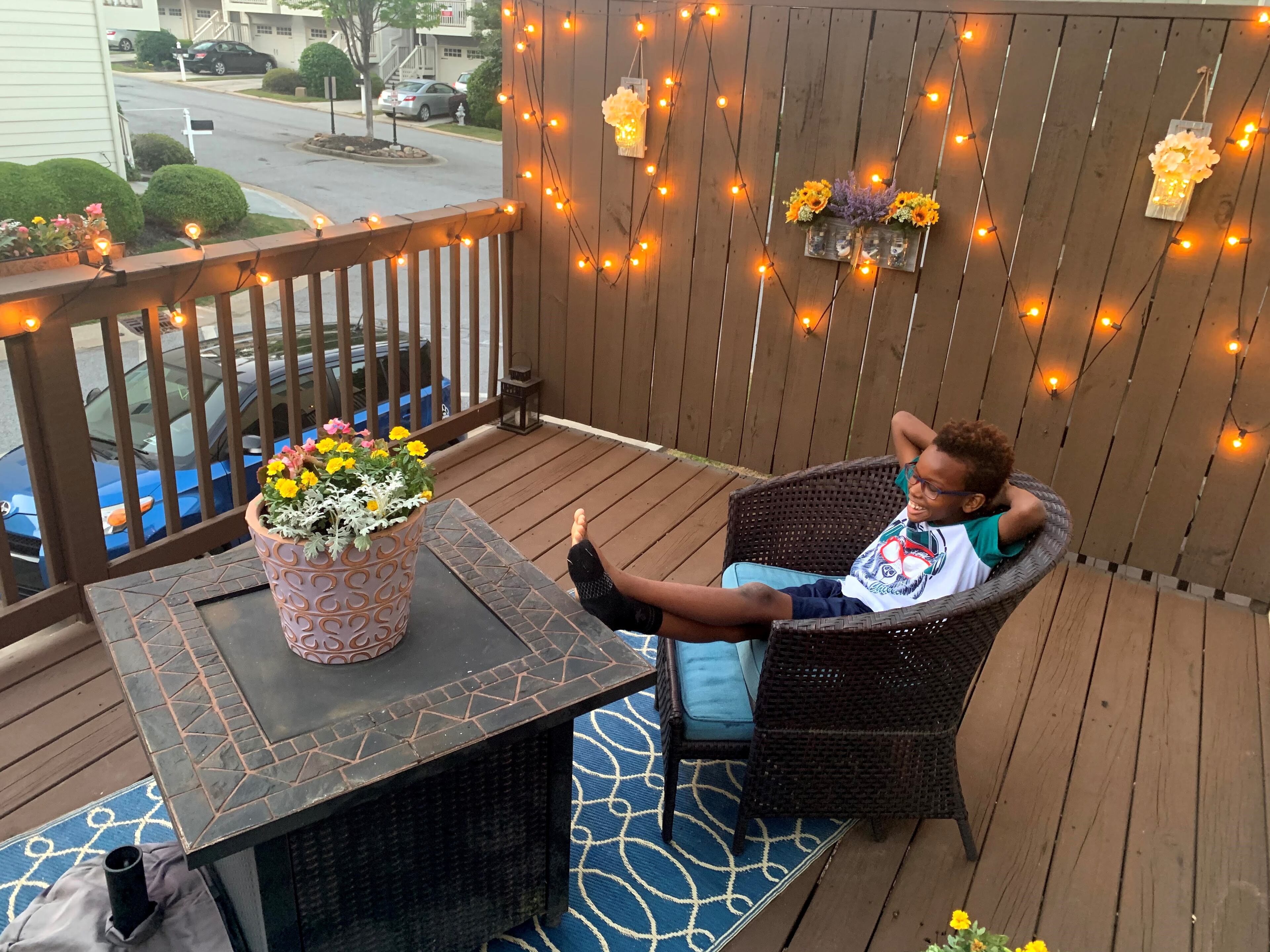 Chase Turner and his family spend time in their outdoor space barbecuing and playing games during family game night.