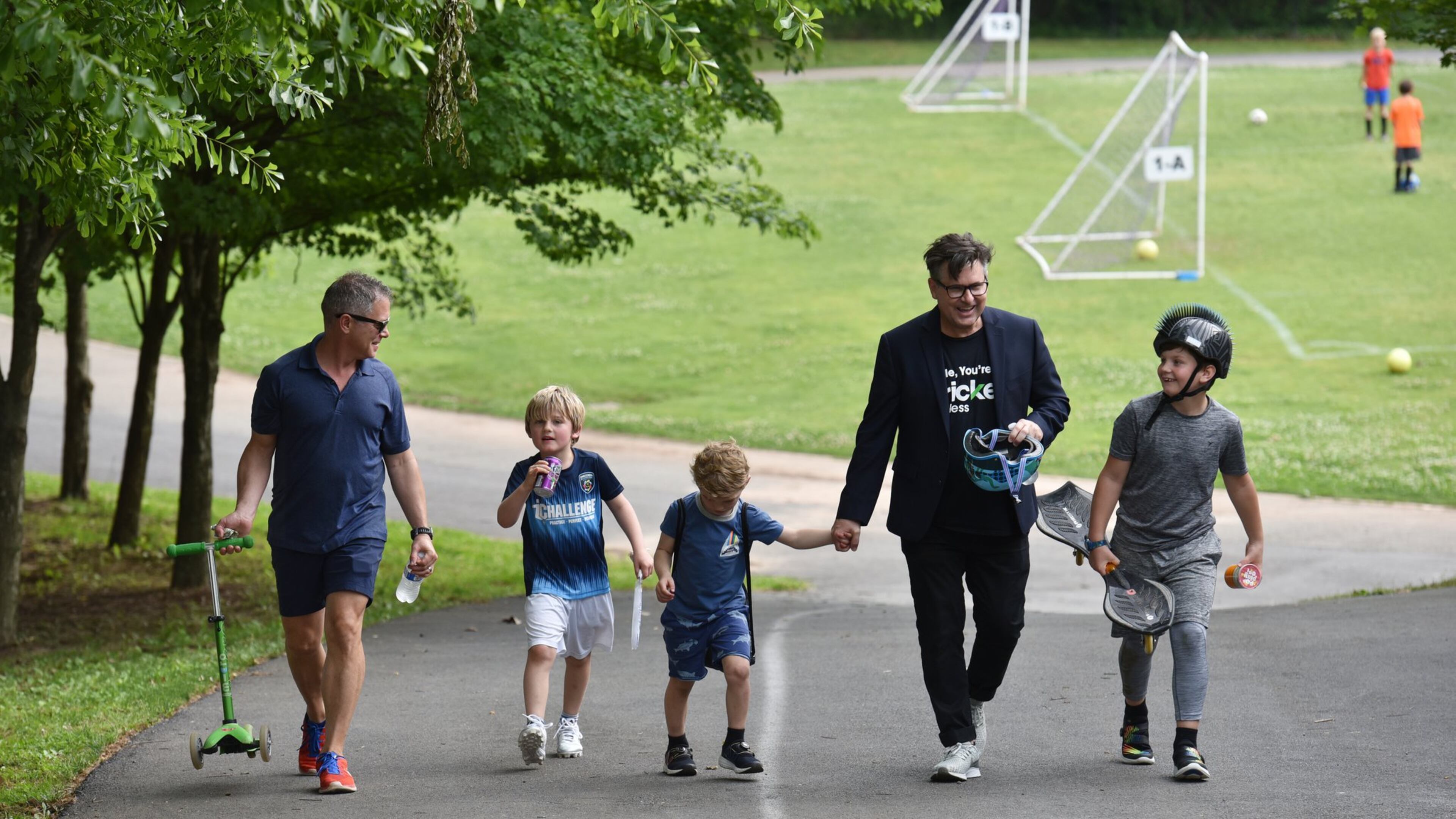This will be the first Father’s Day that they’re officially a family: Matthew Simon and Keith Schumann walk with their sons Hunter, 6, Owen, 4, and Jackson, 10, after soccer practice. HYOSUB SHIN / HSHIN@AJC.COM