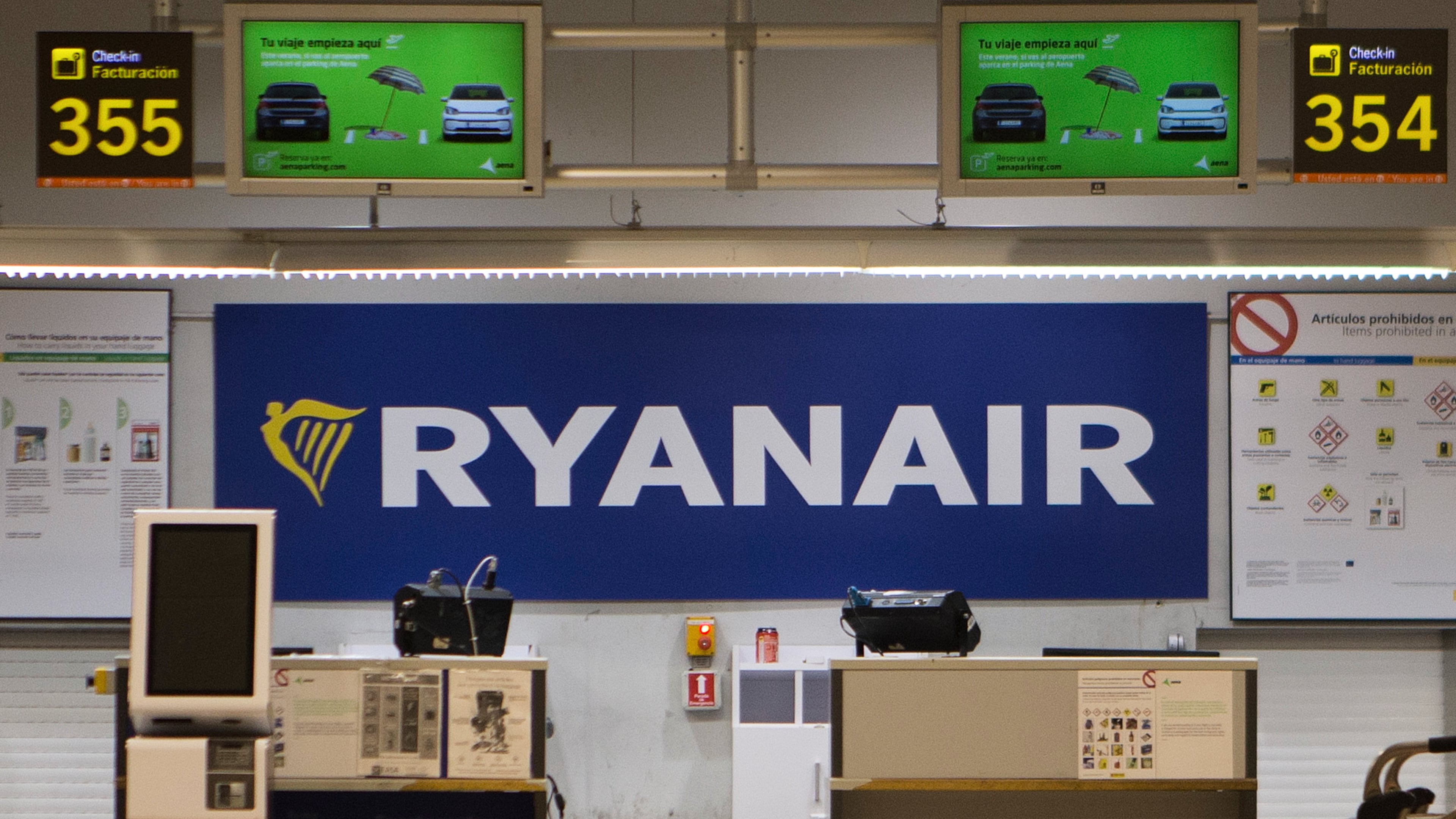 FILE - The Ryanair desk is seen, Aug. 10, 2018, at the Barajas airport in Madrid, Spain. (AP Photo/Paul White, File)