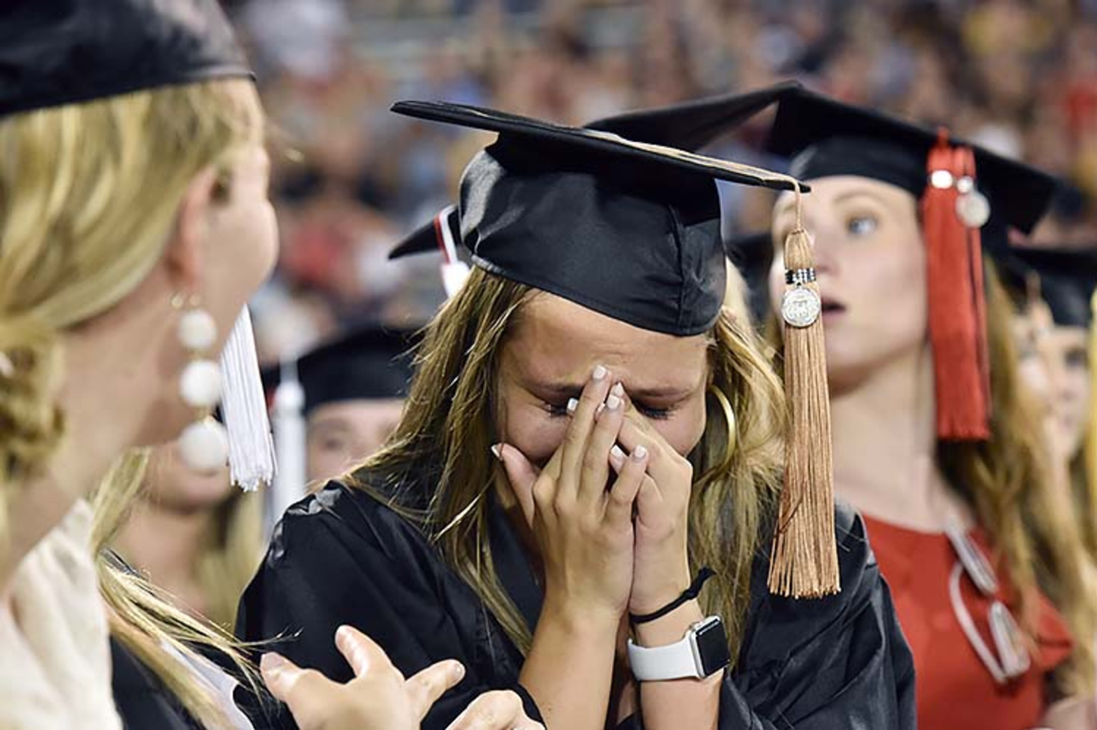 May 10, 2019 Athens - Brooke Ralys cries after she moved her tassel during UGA's 2019 spring undergraduate commencement ceremony at Sanford Stadium in Athens on Friday, May 10, 2019. HYOSUB SHIN / HSHIN@AJC.COM