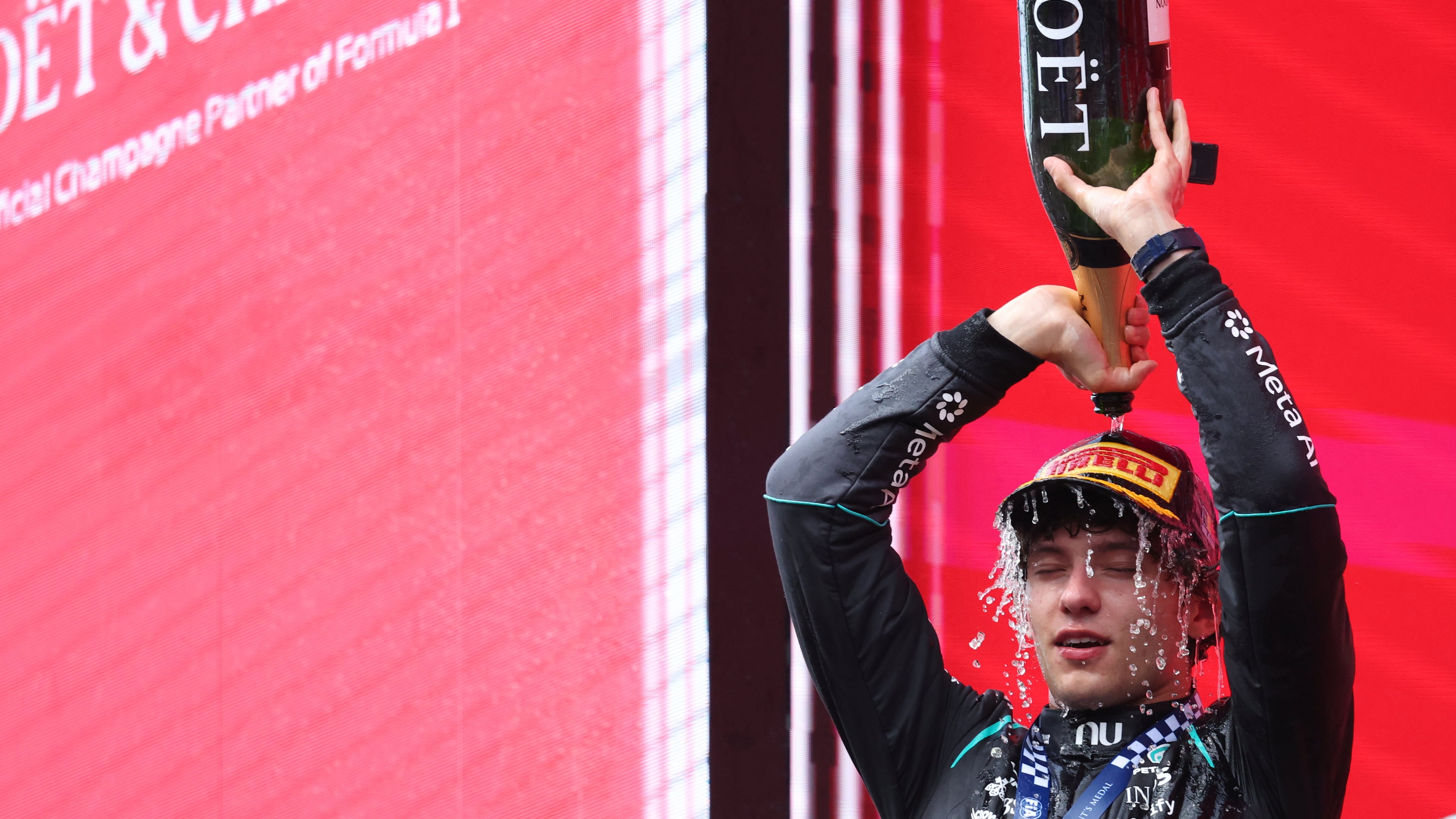 Mercedes driver Andrea Kimi Antonelli of Italy celebrates on the podium after winning the Formula One Grand Prix at the Spa-Francorchamps racetrack in Spa, Belgium, Sunday, July 19, 2026. (AP Photo/Omar Havana)
