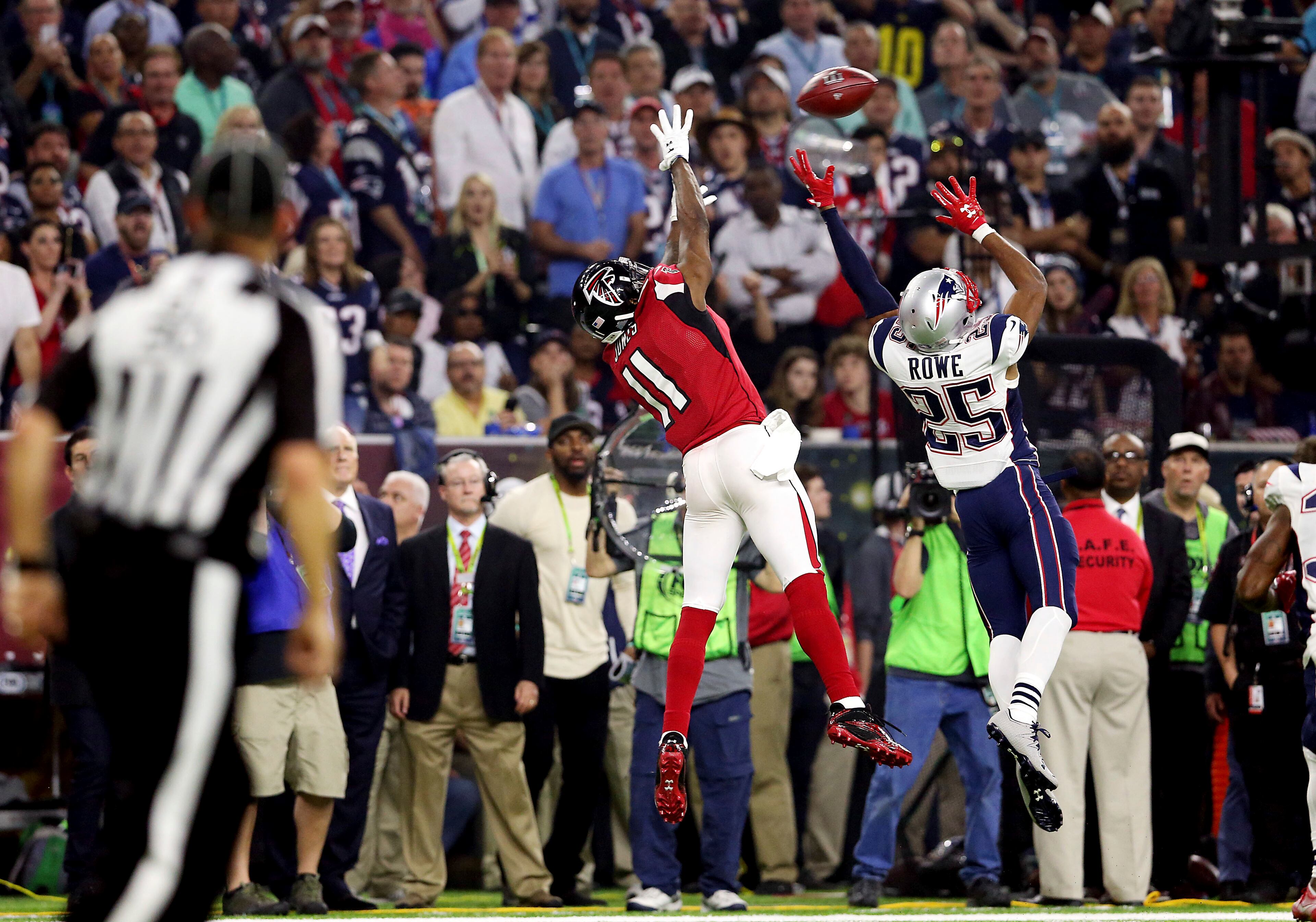 Atlanta Falcons wide receiver Julio Jones (11) makes a sideline catch over New England Patriots defensive back Eric Rowe (25) during Super Bowl 51, Sunday, Feb. 5, 2017 in Houston. (AP Photo/Doug Benc)