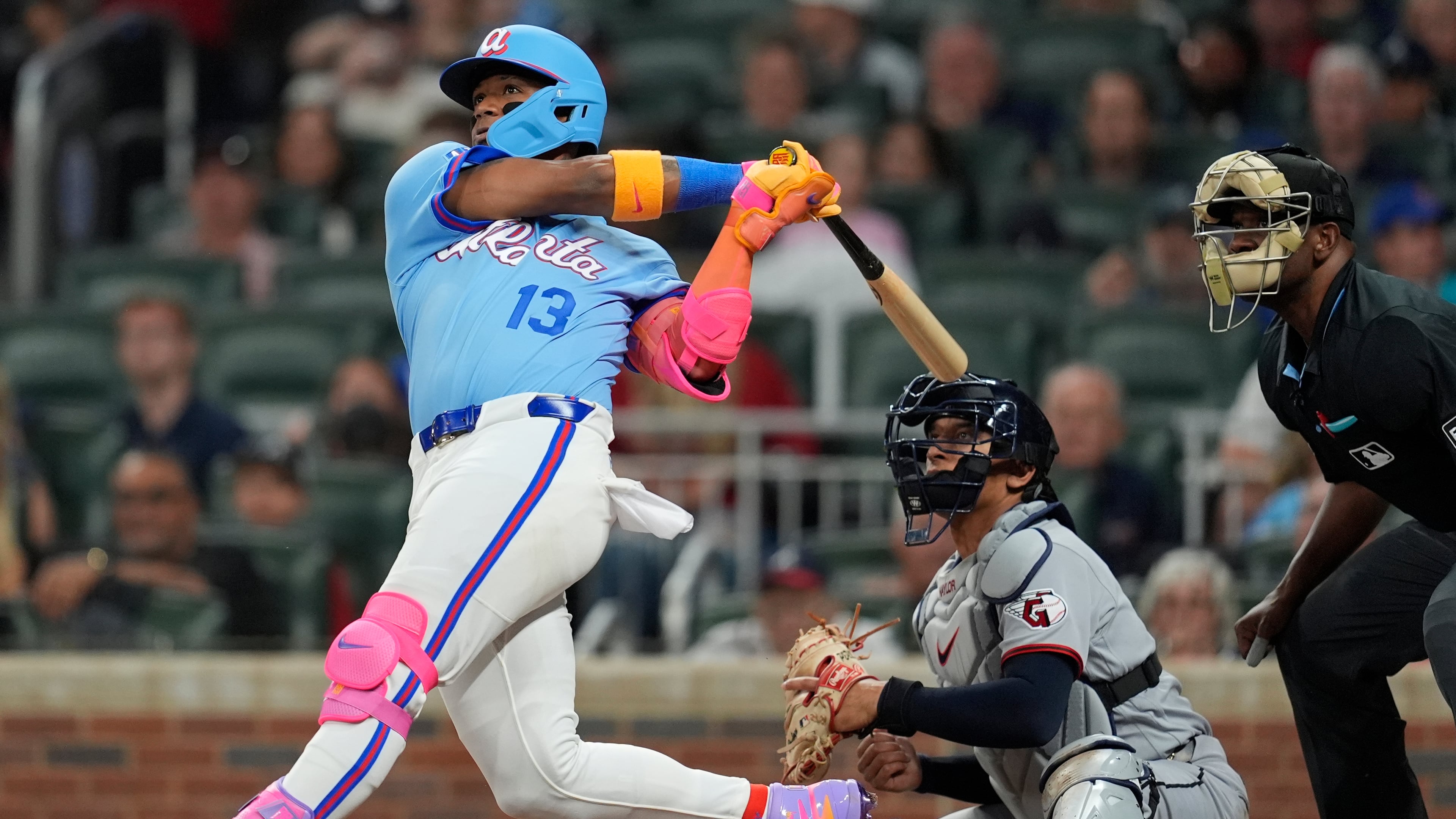 Atlanta Braves' Ronald Acuña Jr. (13) hits a solo homer in the sixth inning of a baseball game against the Cleveland Guardians, Friday, April 10, 2026, in Atlanta. (AP Photo/Mike Stewart)