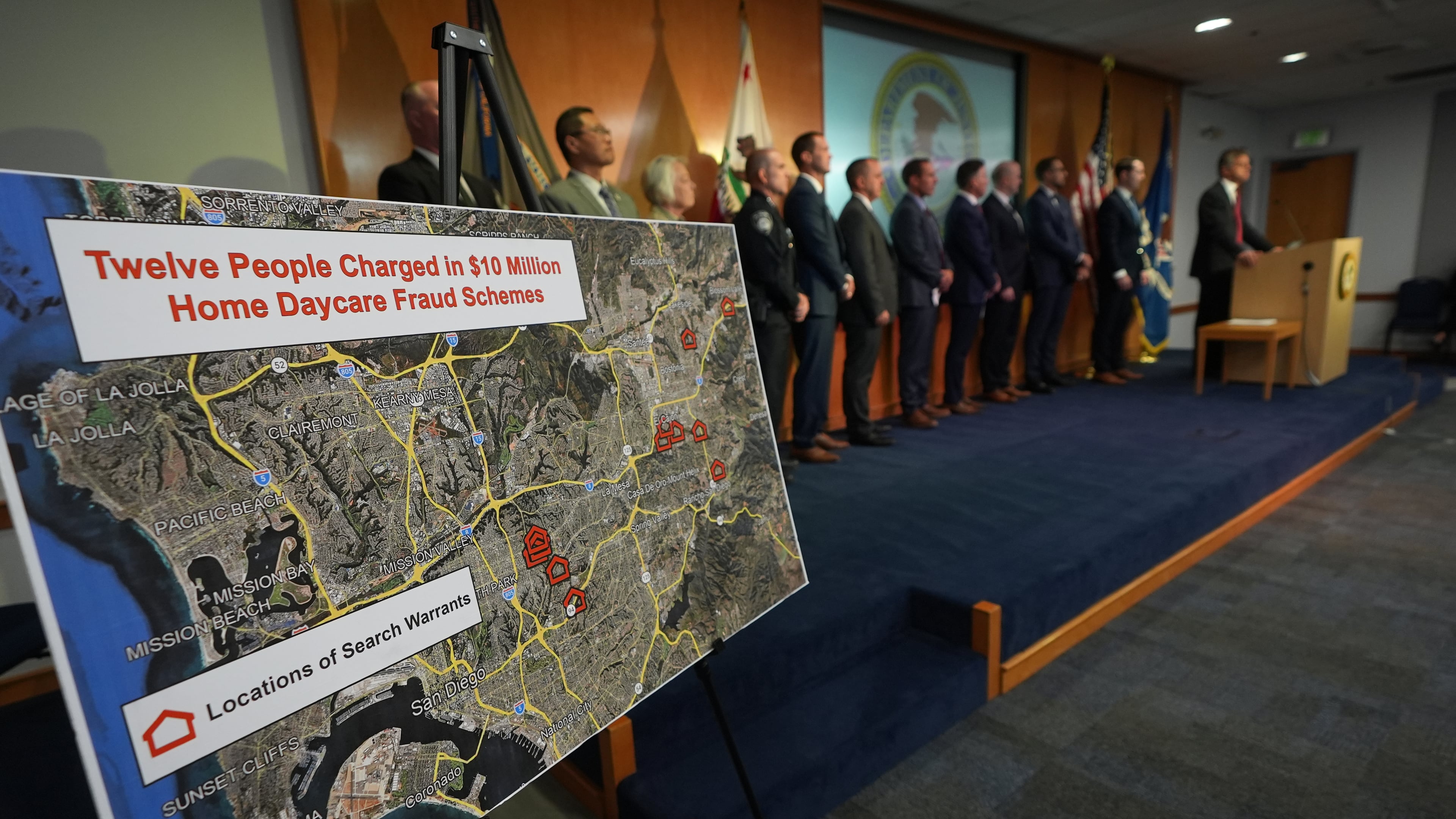 U.S. Attorney Adam Gordon announces charges against a dozen individuals for fraudulently collecting childcare payments during a press event, Tuesday, Sept. 15, 2026, in San Diego. (AP Photo/Gregory Bull)
