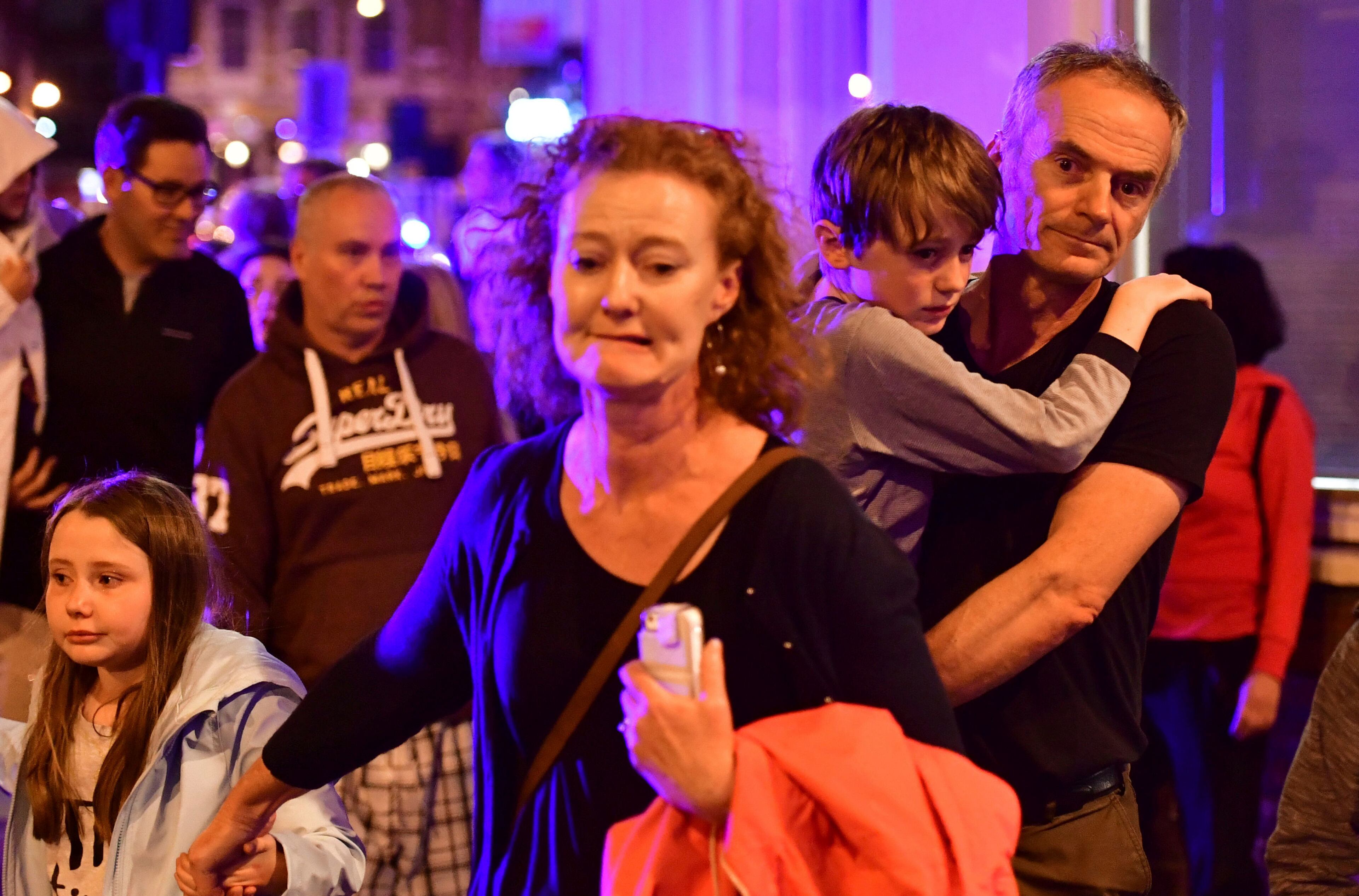 People run down Borough High Street as police are dealing with an incident on London Bridge in London, Saturday, June 3, 2017. Transport for London Says London Bridge closed in both directions due to police activity. (Dominic Lipinski/PA via AP)