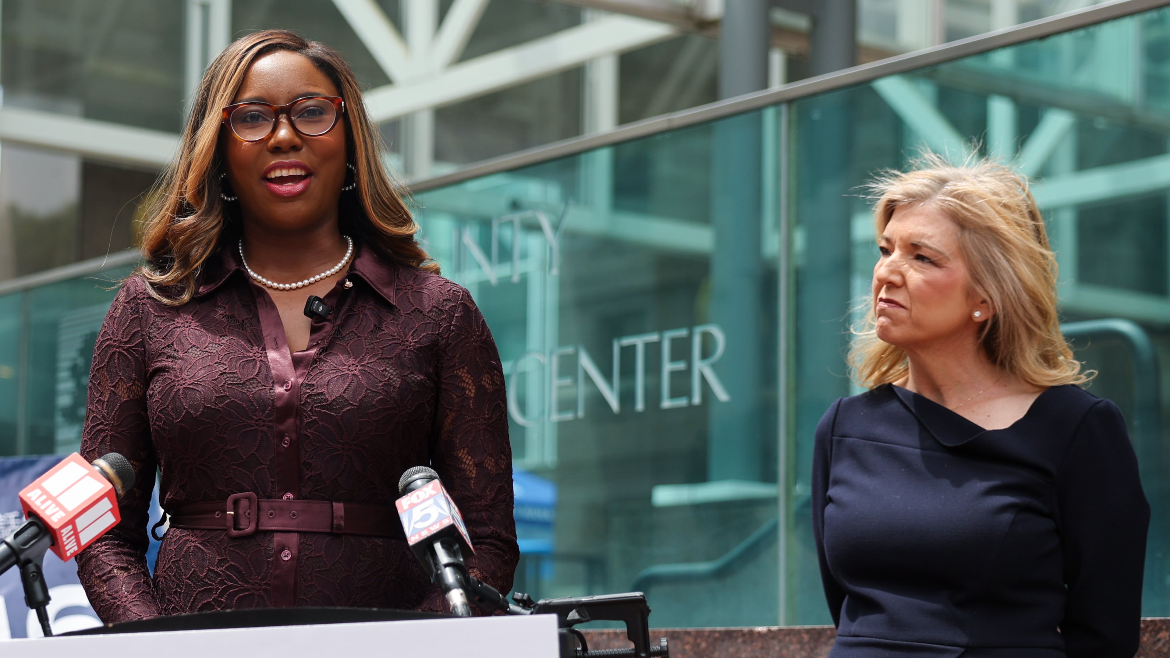 Georgia Supreme Court candidates Miracle Rankin (left) and Jen Jordan speak at a press conference at Fulton County Government Center in April. (Arvin Temkar/AJC)