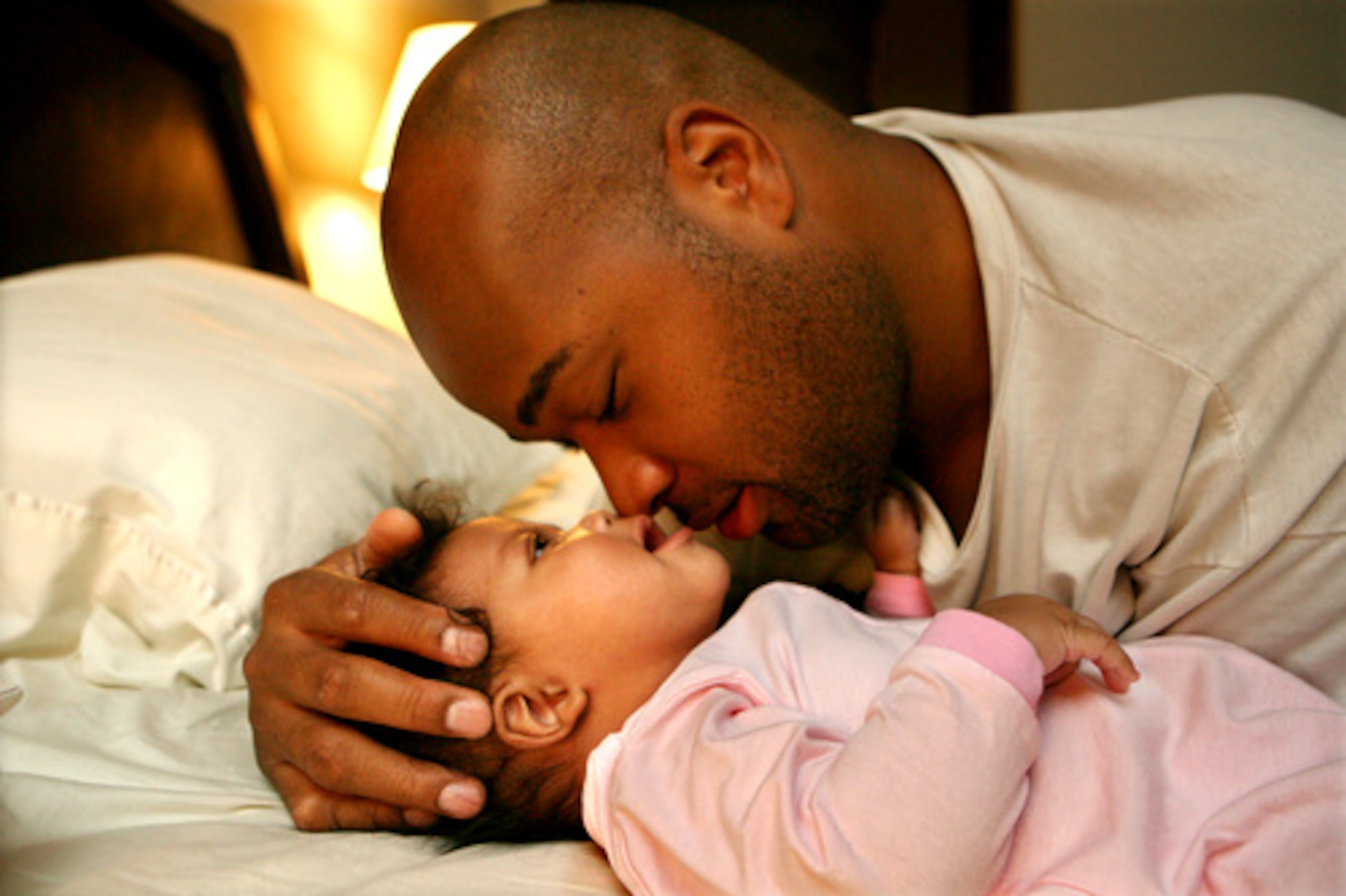 The first hours of the day belong to Eric and Lia, now 4 months old. He feeds, bathes and plays with her as his wife undergoes cancer treatment.