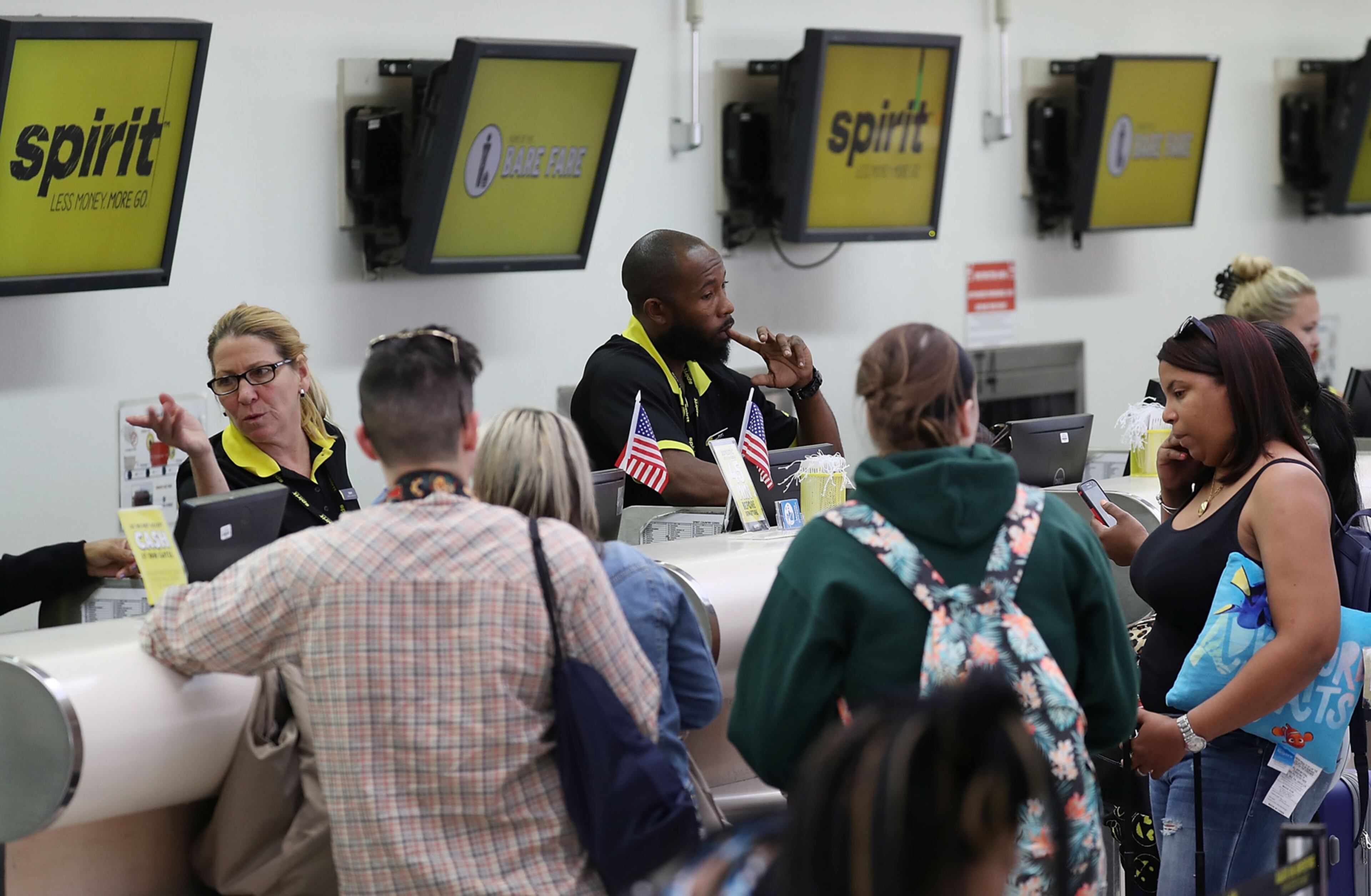 FORT LAUDERDALE, FL - MAY 09: People check in at the Spirt Airlines counter at the Fort Lauderdale-Hollywood International Airport on May 9, 2017 in Fort Lauderdale, Florida. Yesterday a chaotic scene erupted at the Spirit Airlines counter after flights were canceled which led to passengers getting irate and the police had to move in to restore order. Spirit blamed the delays on its pilots, who are negotiating for a new contract. (Photo by Joe Raedle/Getty Images)